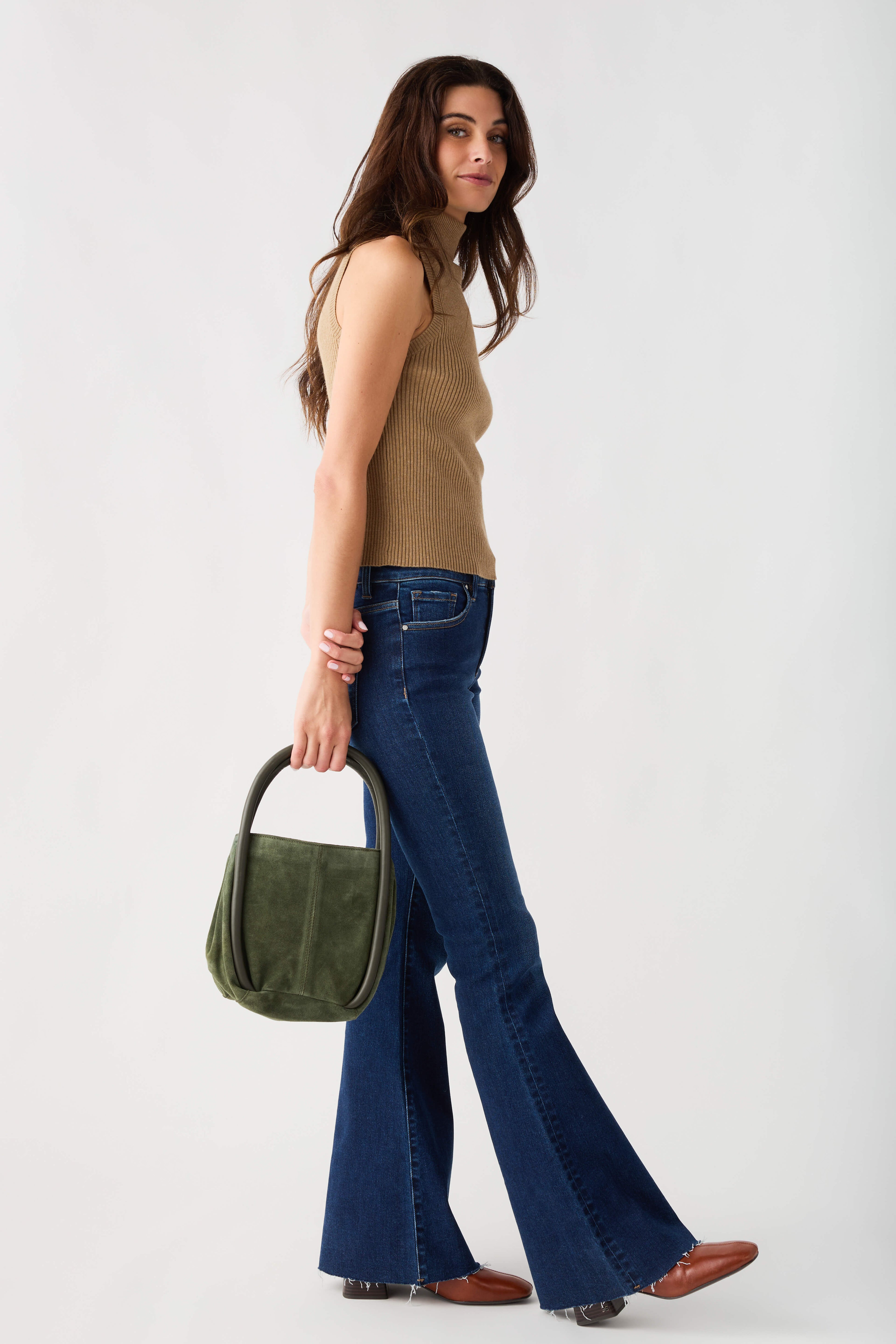 Sleeveless ribbed mock-neck top in tan-brown, side profile with high neckline.