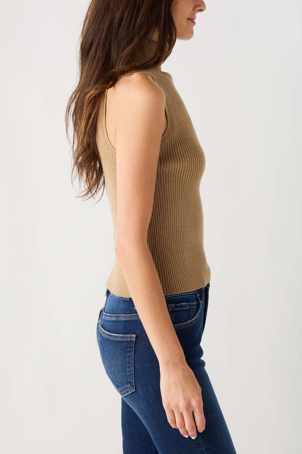Sleeveless ribbed turtleneck top in tan, side view