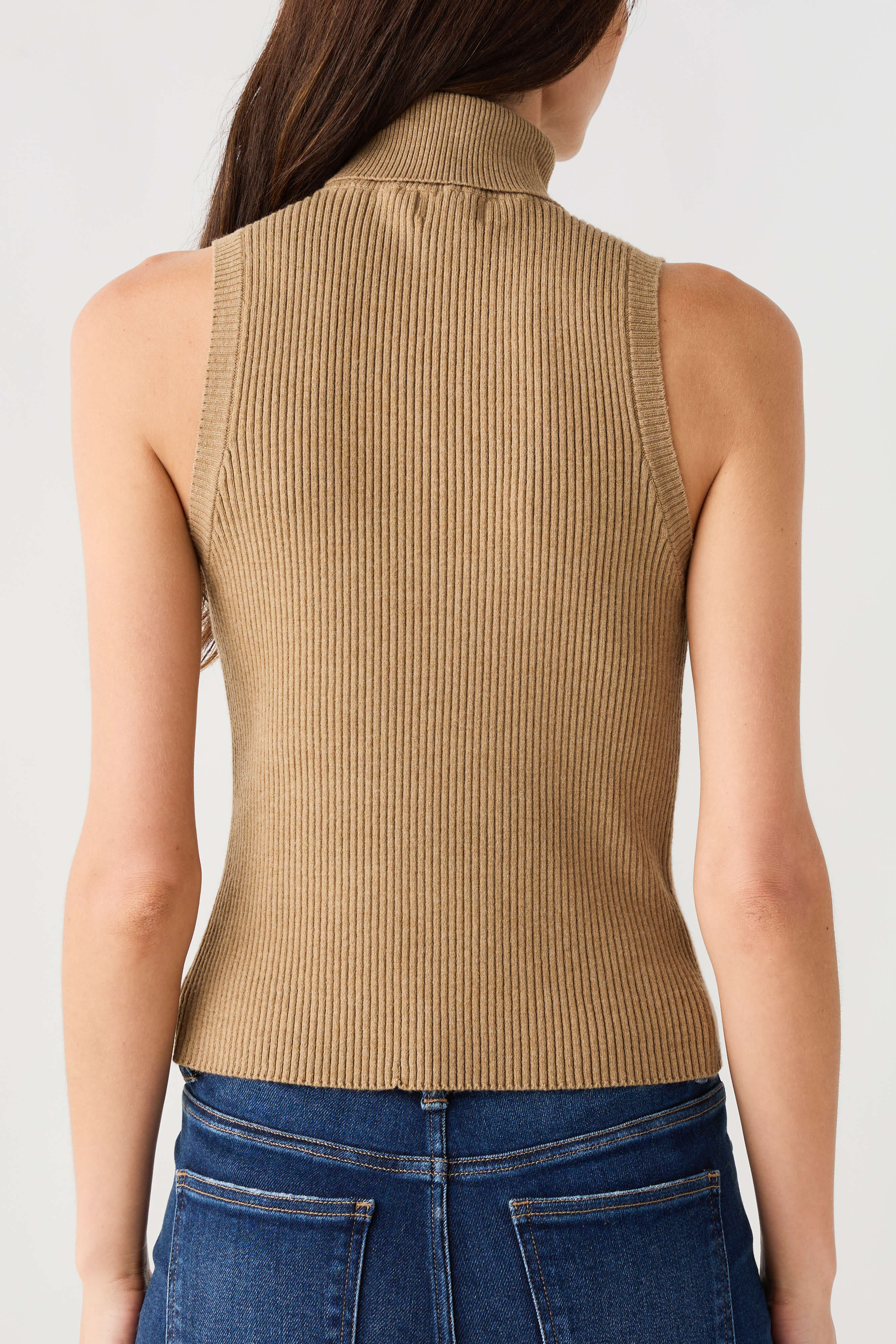 Sleeveless ribbed turtleneck top in tan, back view