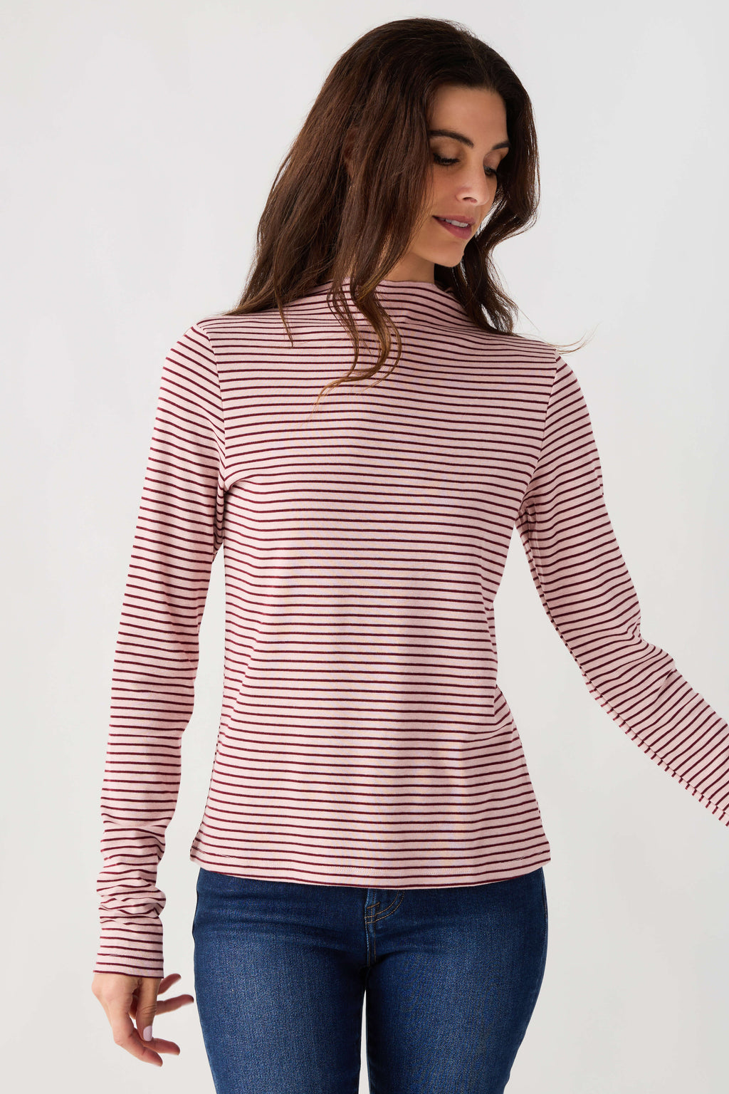 Mauve-and-white striped mockneck knit top with long sleeves, fitted waist