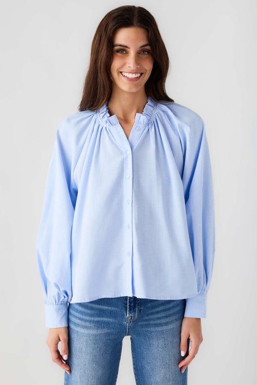 Light blue ruffle button-down blouse with button front, gathered yoke, balloon sleeves