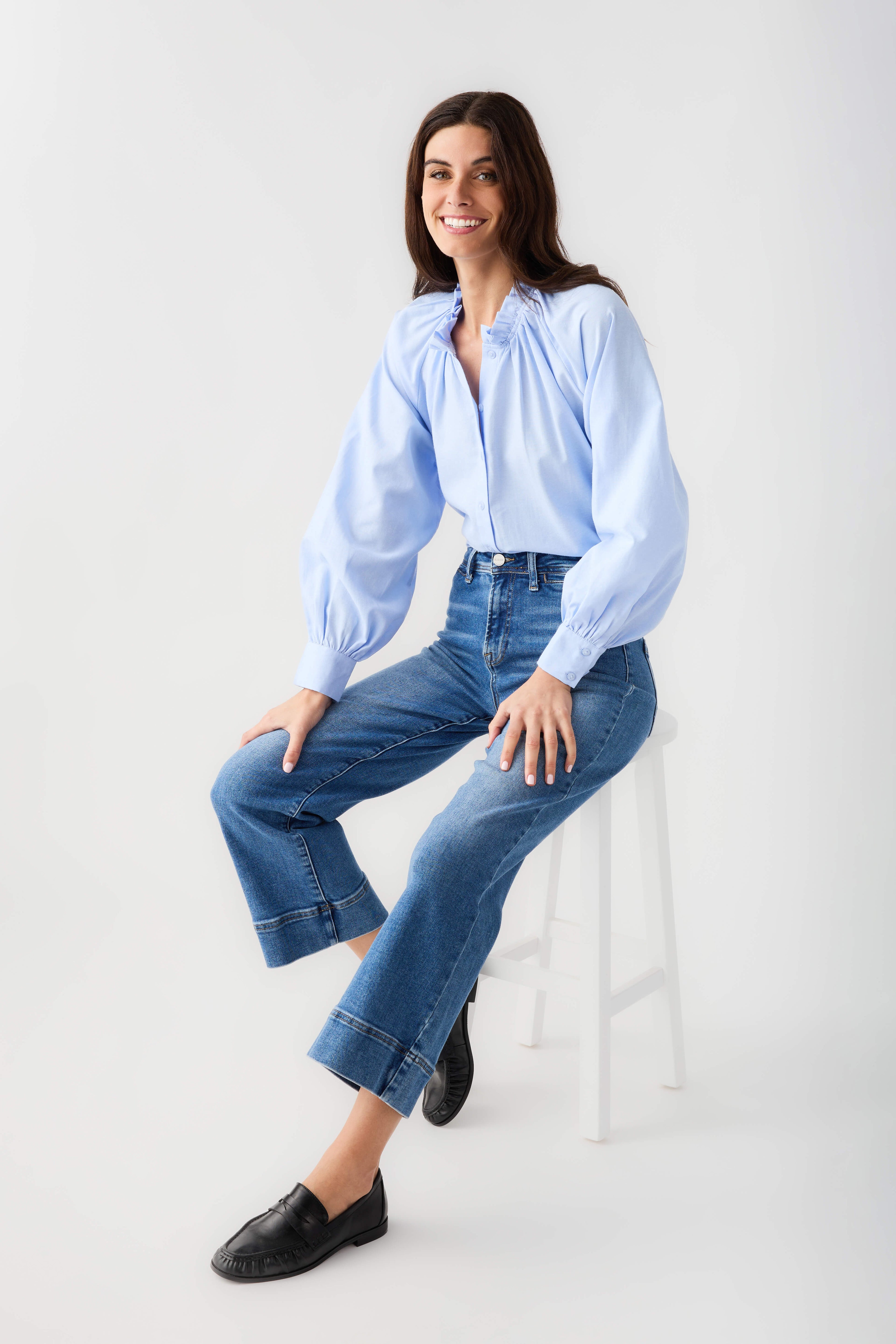 Black leather loafer on model with jeans and low rounded toe