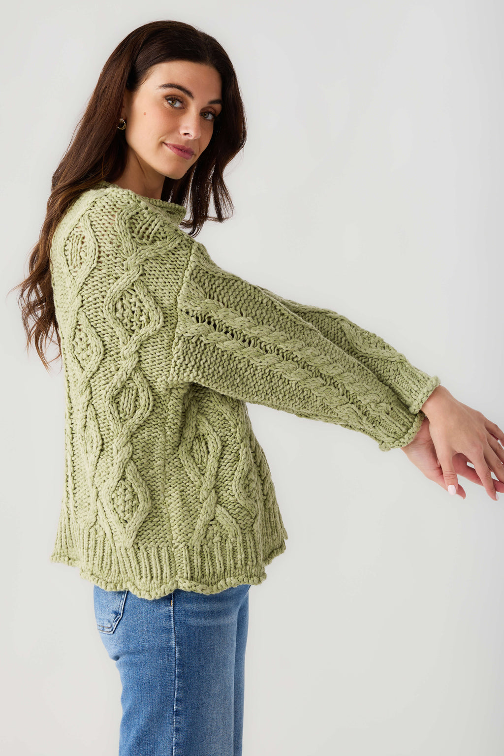 Light green cable-knit cardigan with long sleeves and button front detail