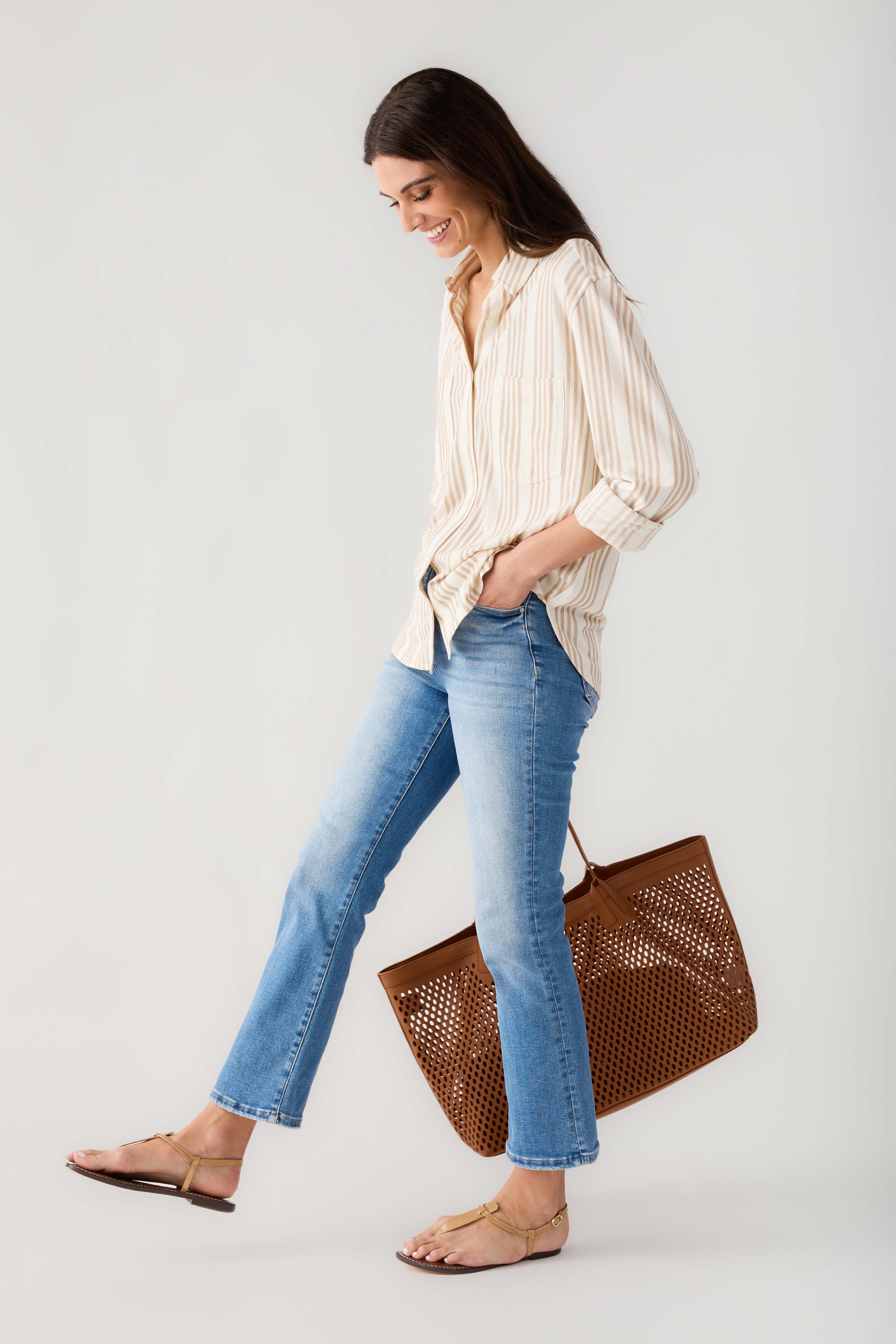 Cream and tan striped button-up shirt with long sleeves and front buttons