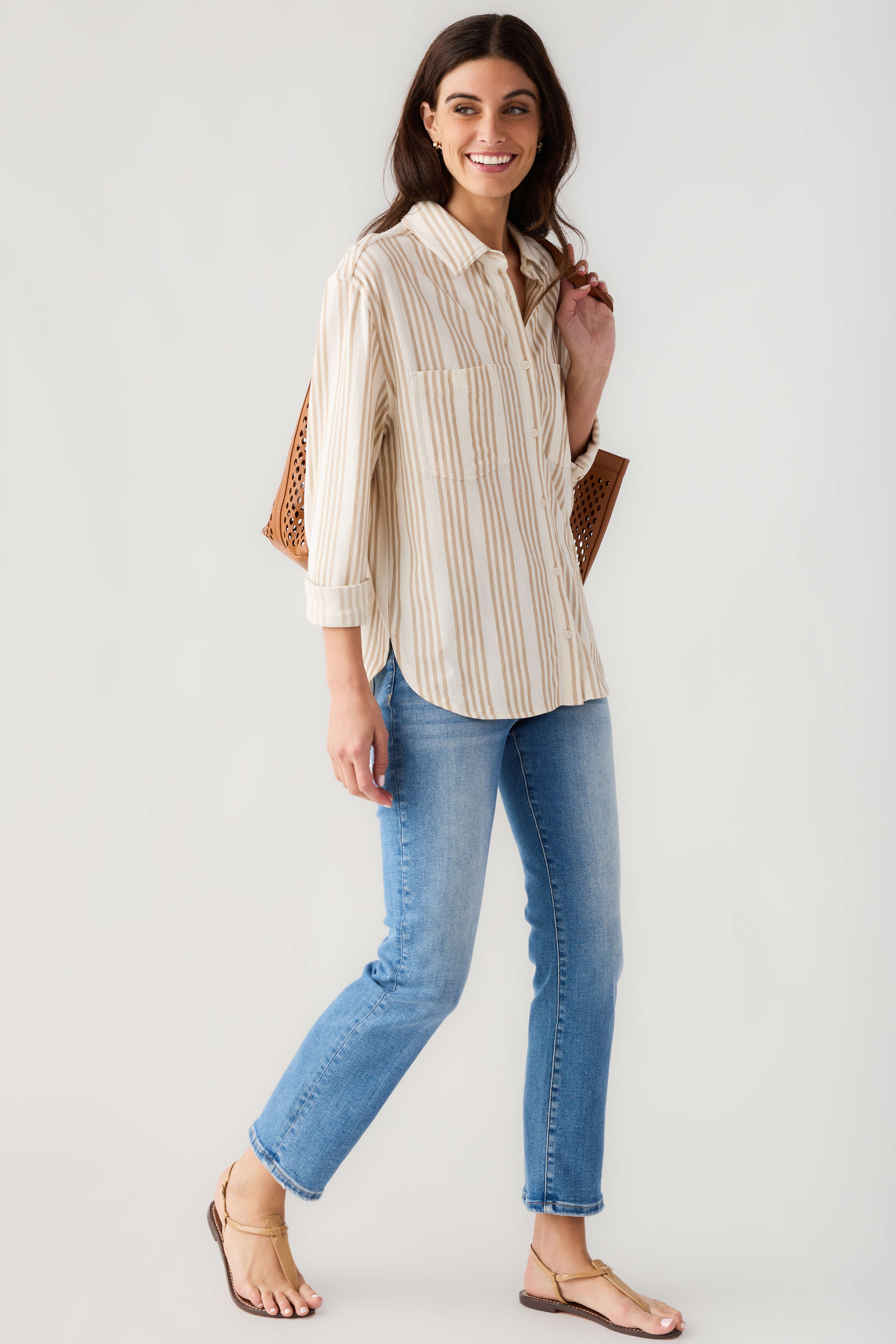Cream and tan striped button-up shirt with long sleeves, collar, and front placket