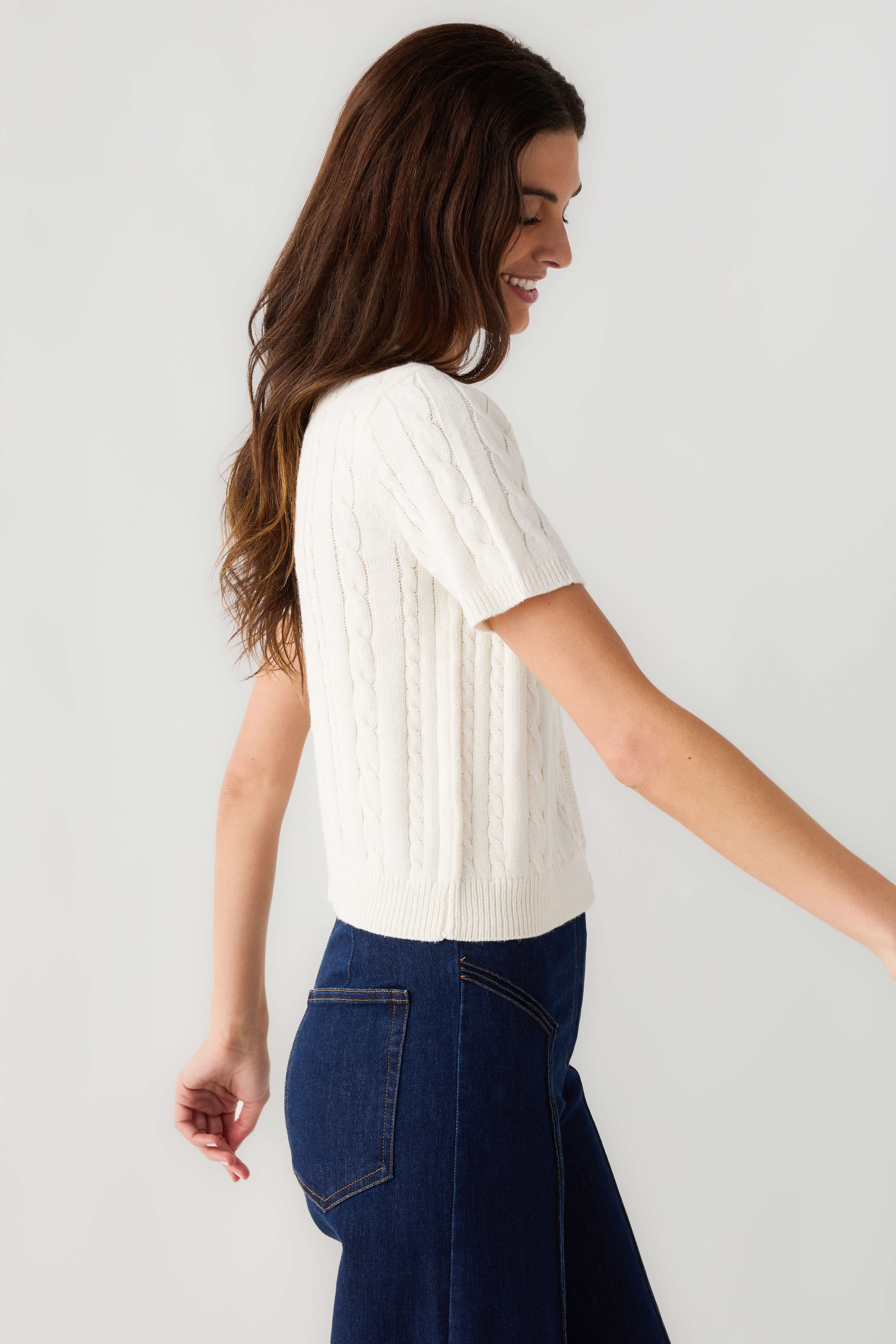 Off-white cable-knit short-sleeve cardigan, side profile