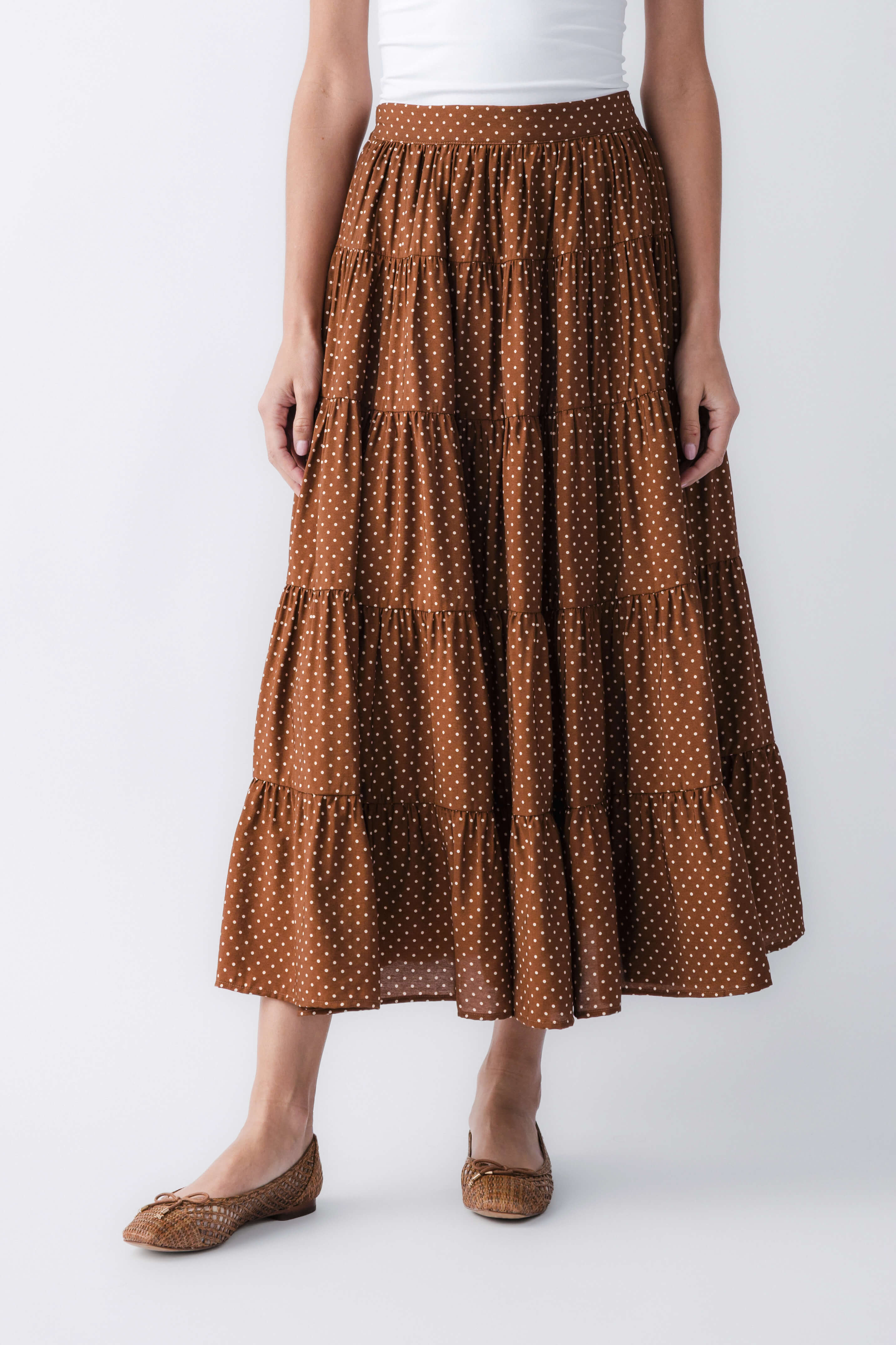 Brown polka-dot tiered maxi skirt with elastic waistband