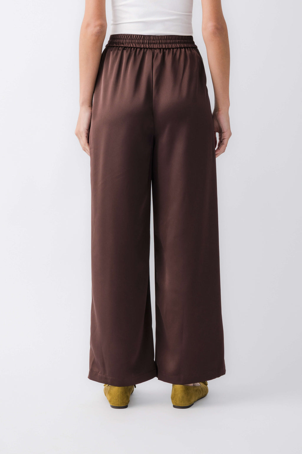 Espresso satin wide-leg pants, back view with elastic waistband and drawstring