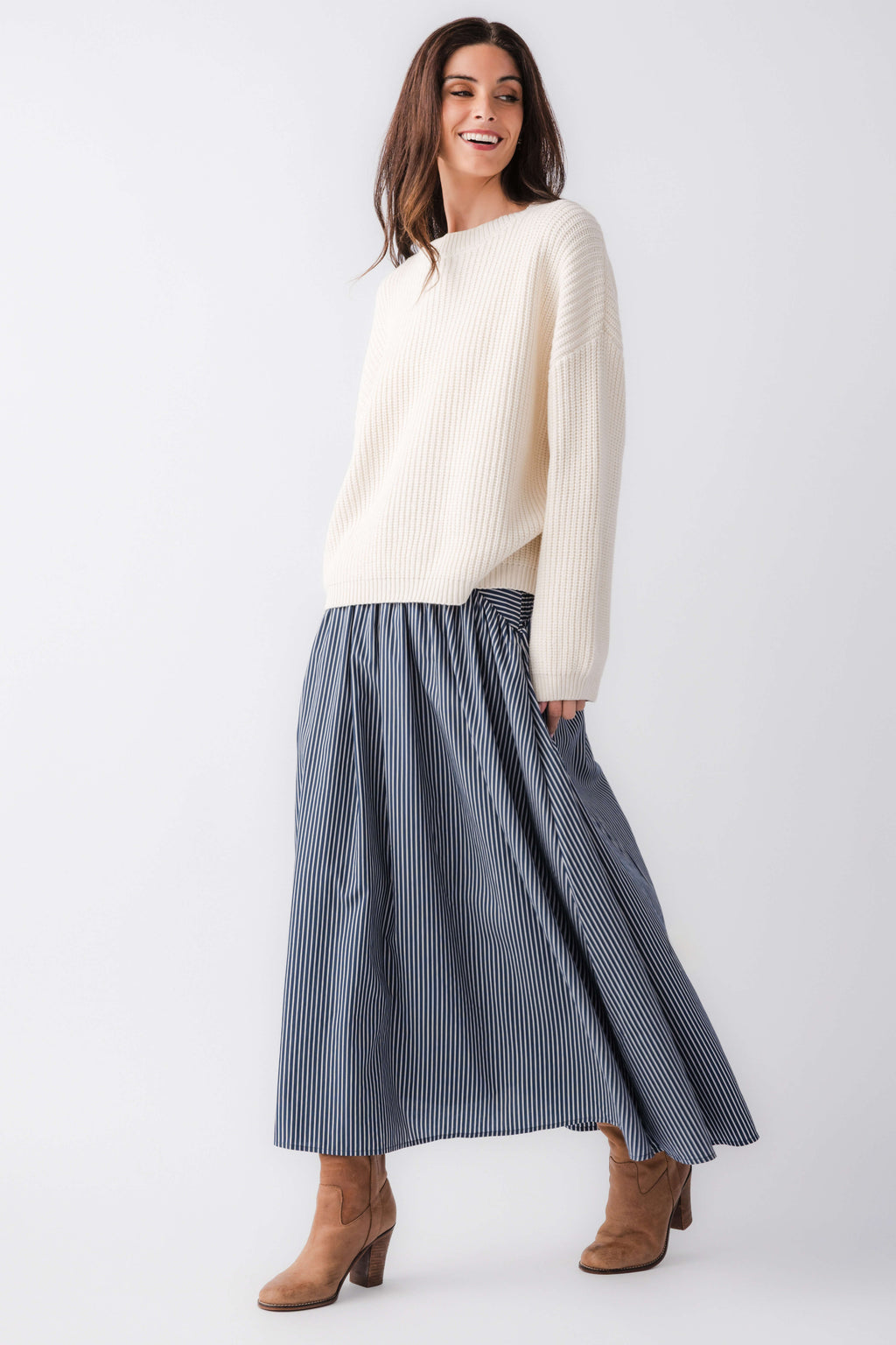 Blue-and-white striped maxi skirt with gathered drop-waist seam and flared hem