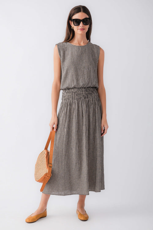 Black and white gingham sleeveless top with crew neck and gathered waist