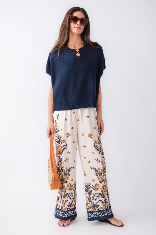 Ink blue dropped-shoulder knit top with short sleeves and ribbed crew neckline