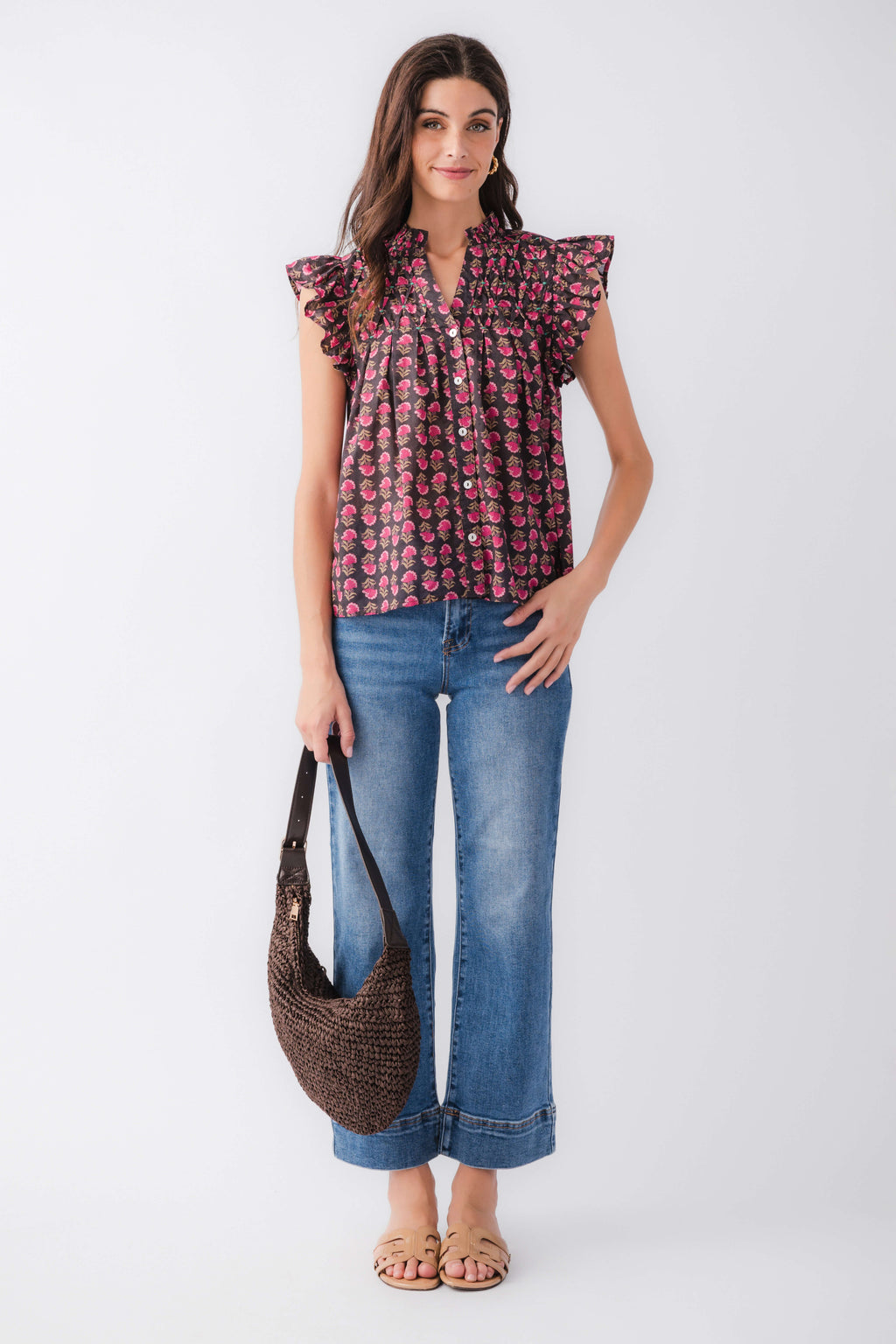 Flutter sleeve button-up top with dark base and pink block print, ruffled neckline