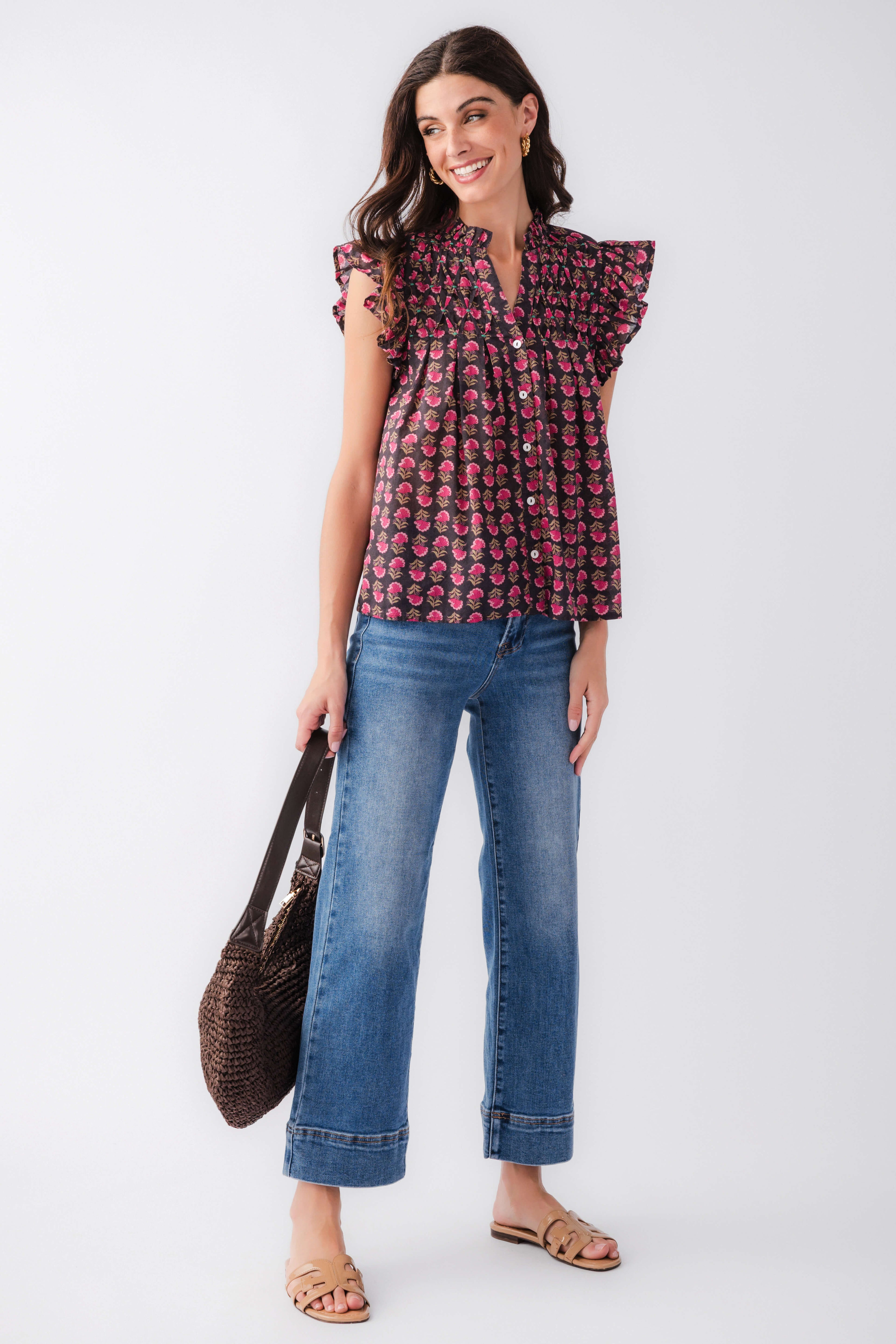 Flutter sleeve button-up top with dark base and pink block print, ruffled shoulders