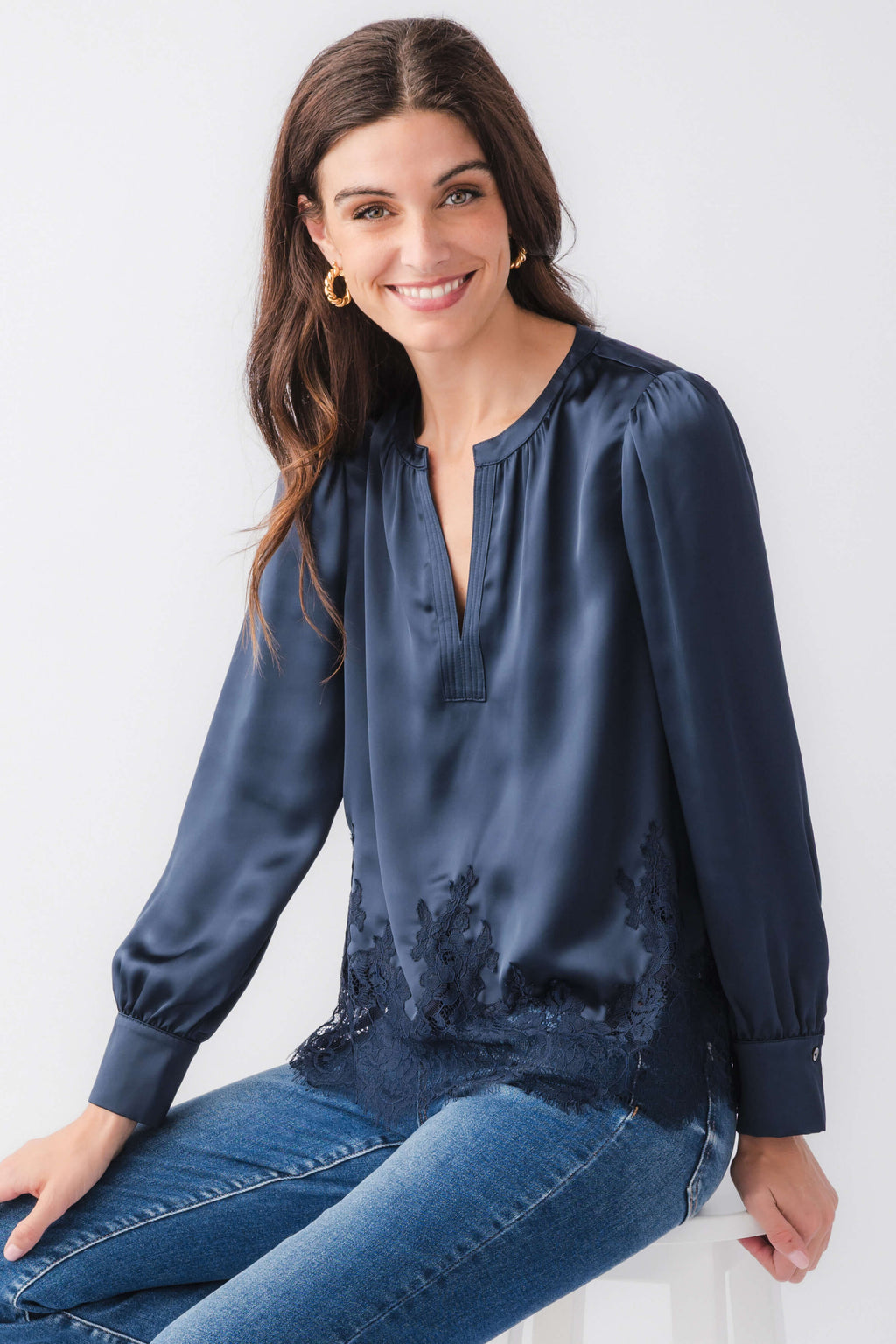 Navy splitneck satin top with lace trim hem and long sleeves, relaxed fit