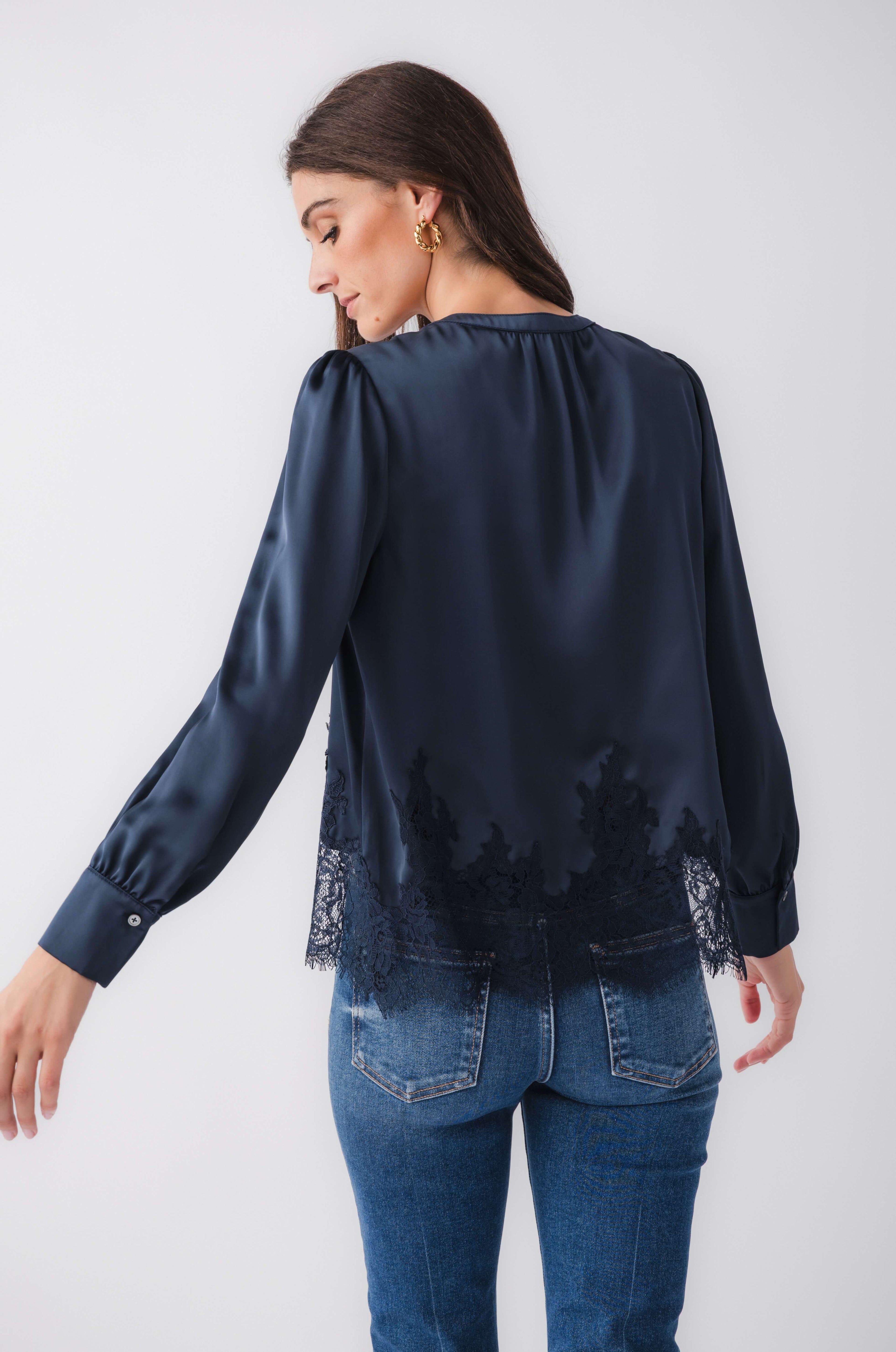 Back view of navy splitneck satin top with lace hem and gathered shoulders