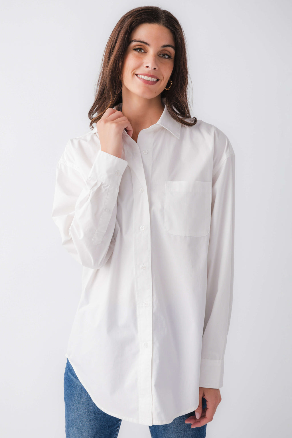 White poplin button-down top with pointed collar and long sleeves