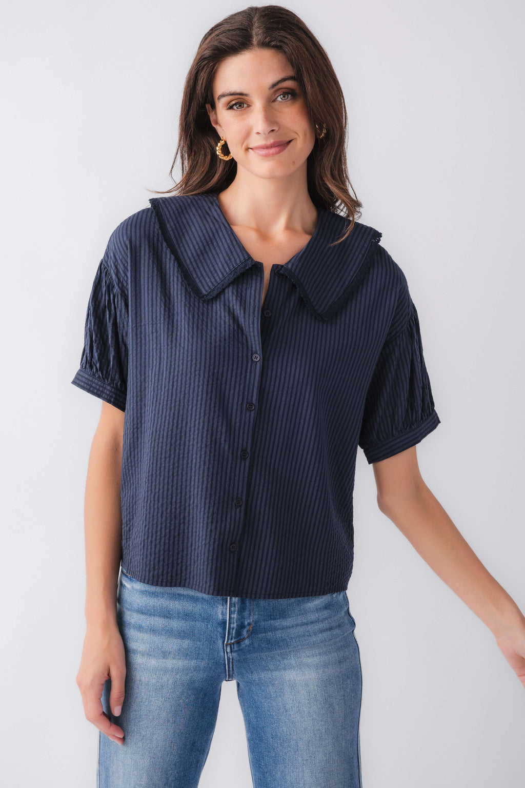 Midnight blue pinstripe short-sleeve top with peter pan collar and button placket