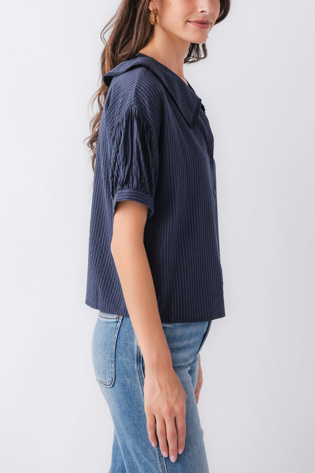 Midnight blue pinstripe short-sleeve top with peter pan collar, side view