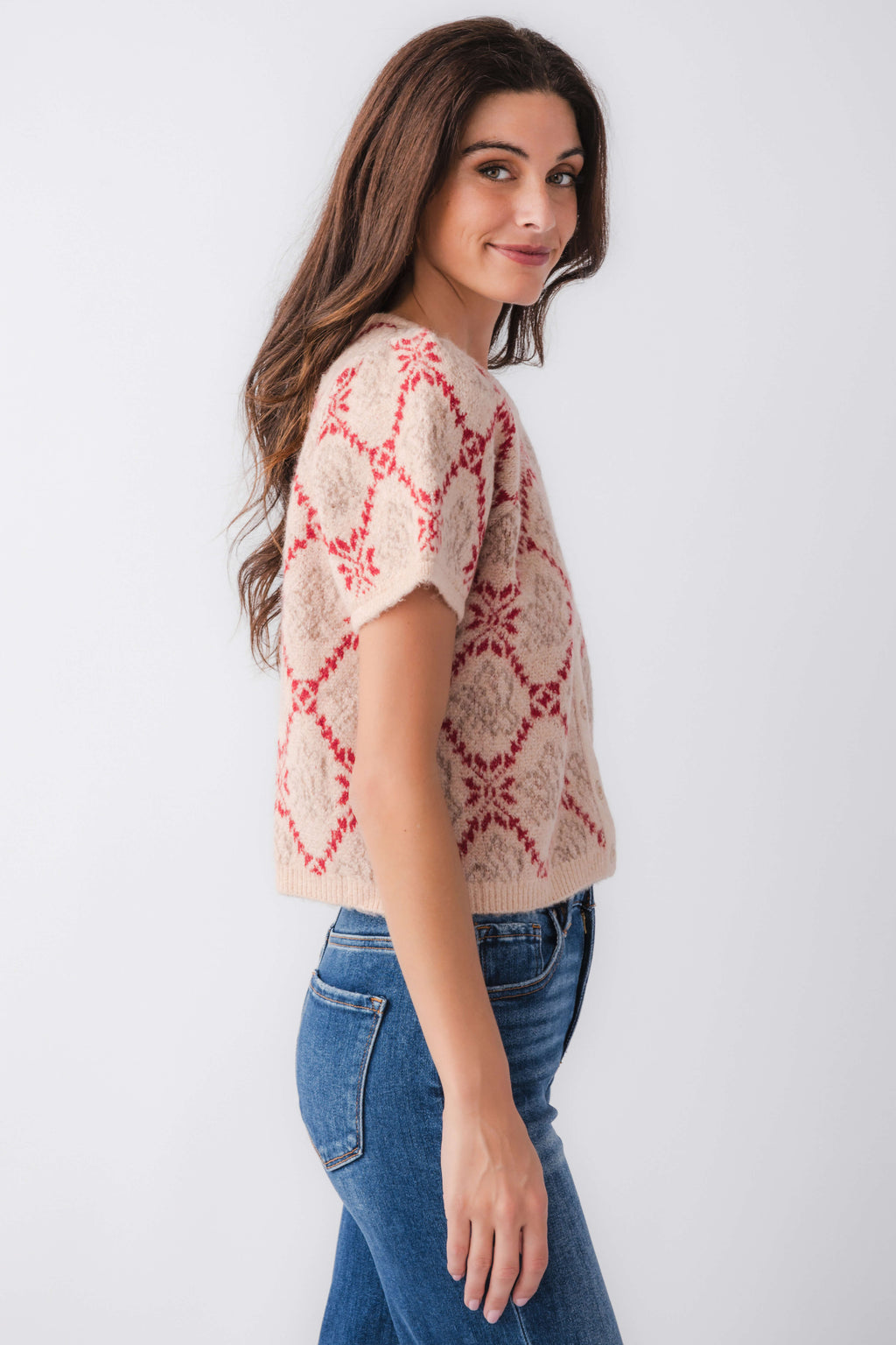 Women’s short-sleeve sweater top in sand knit with red floral pattern and button front