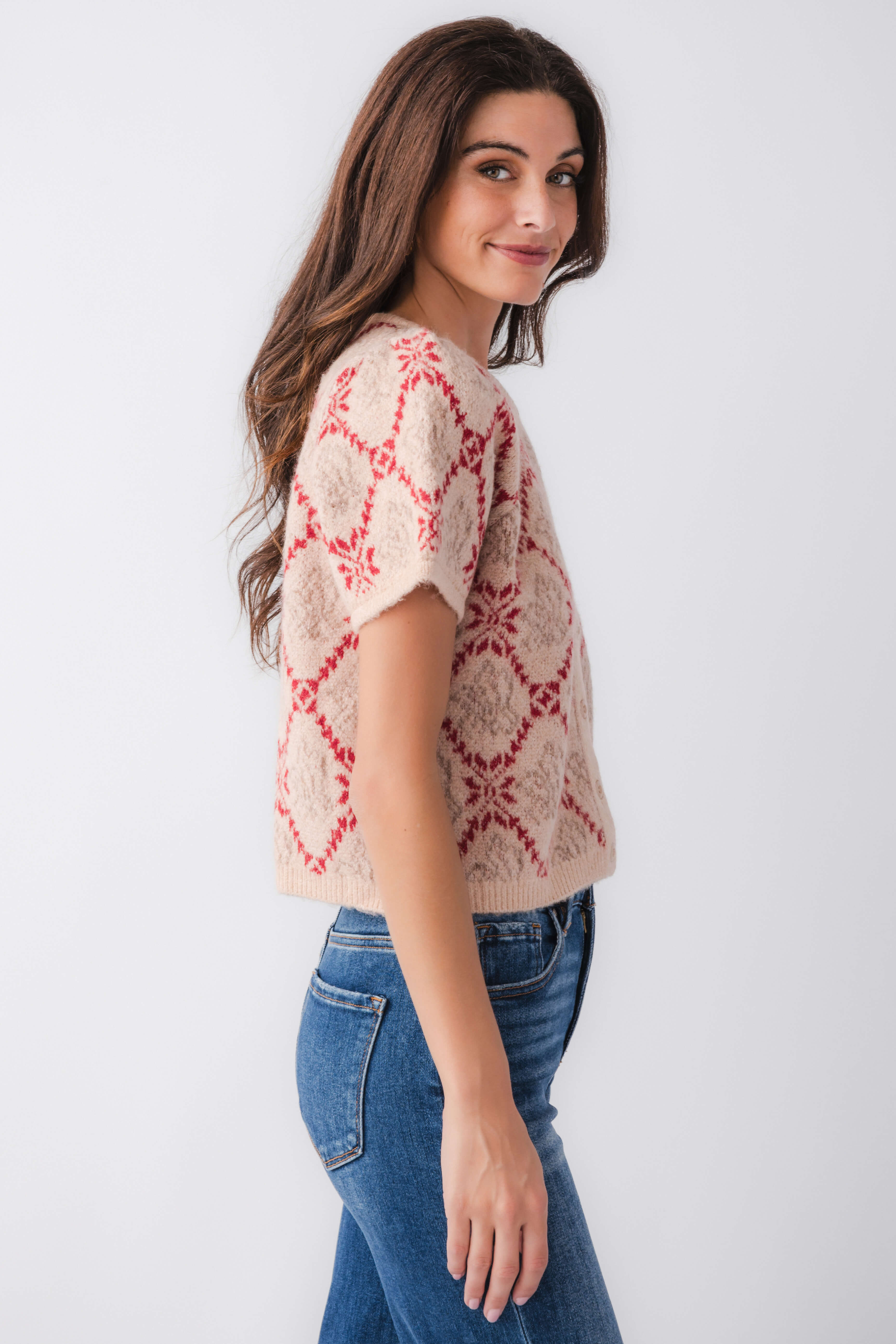 Women’s short-sleeve sweater top in sand knit with red floral pattern and button front