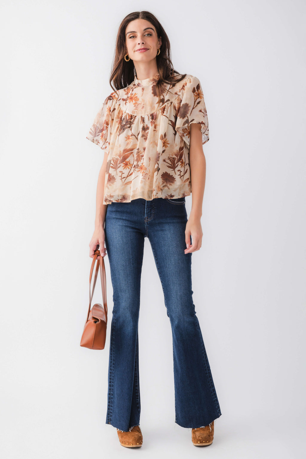 Tan floral blouse top with ruffled neckline and short sleeves, full front view