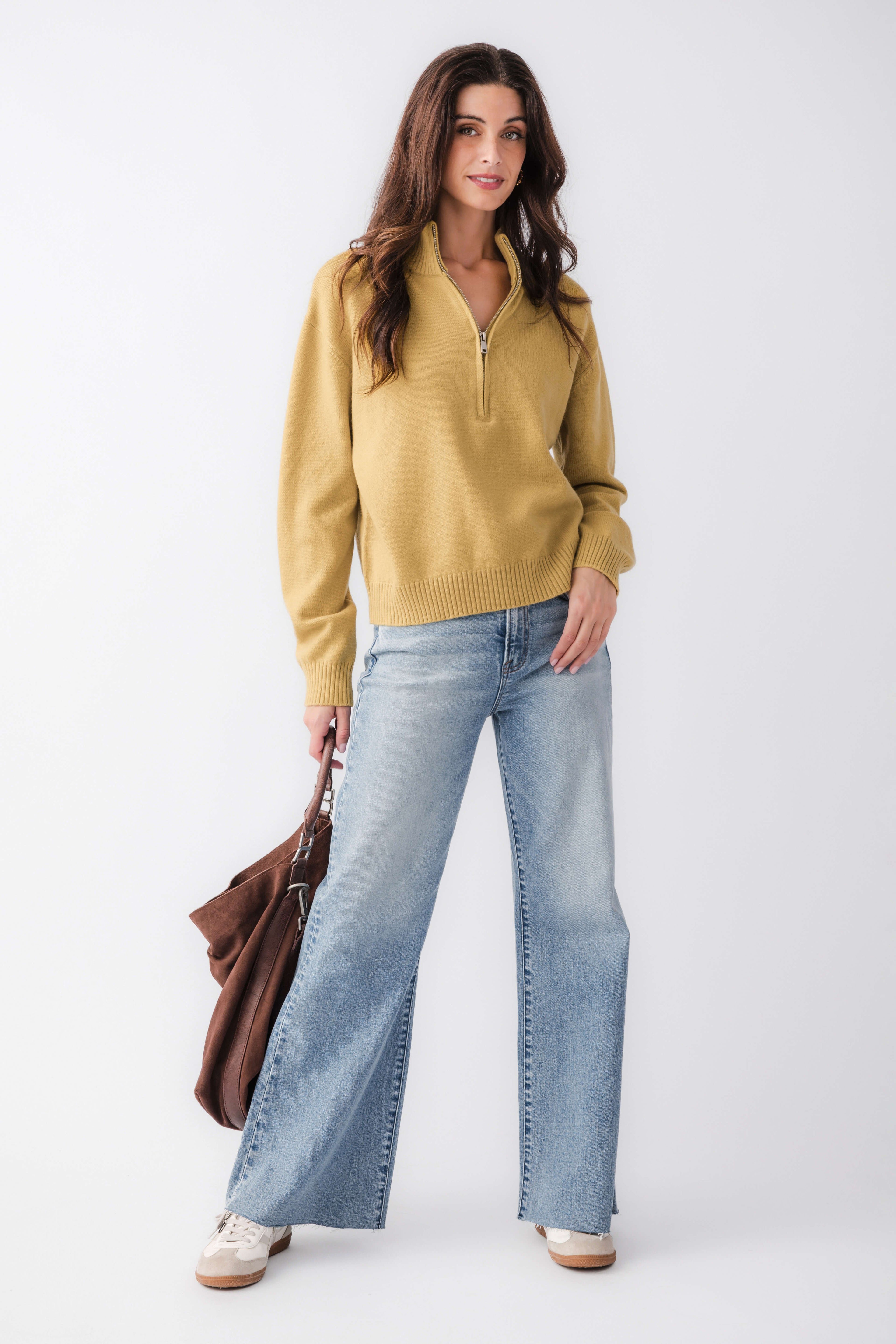 Women's gold half-zip turtleneck sweater with ribbed hem and relaxed fit