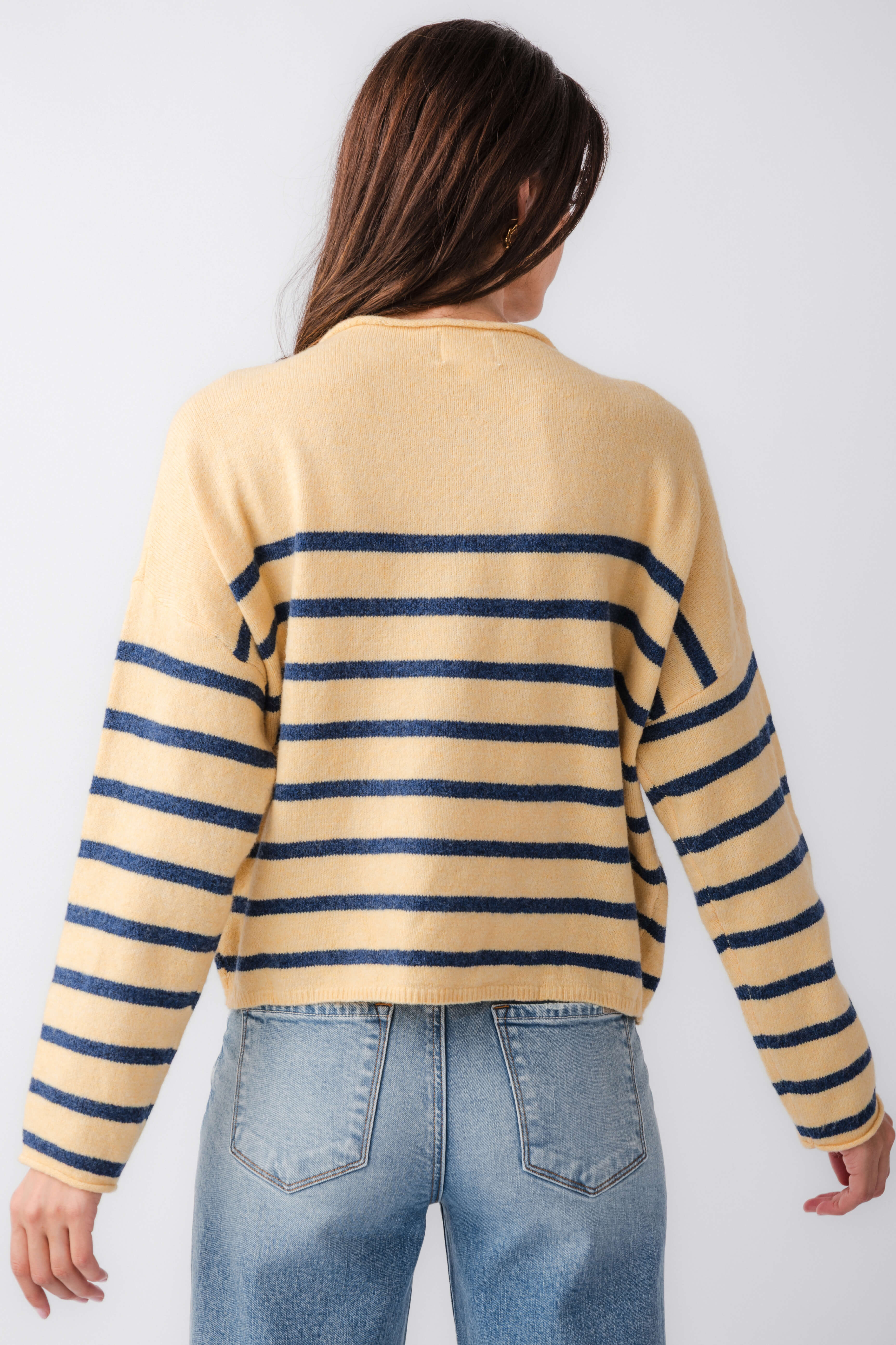 Back view of butter yellow striped mockneck sweater with navy horizontal bands