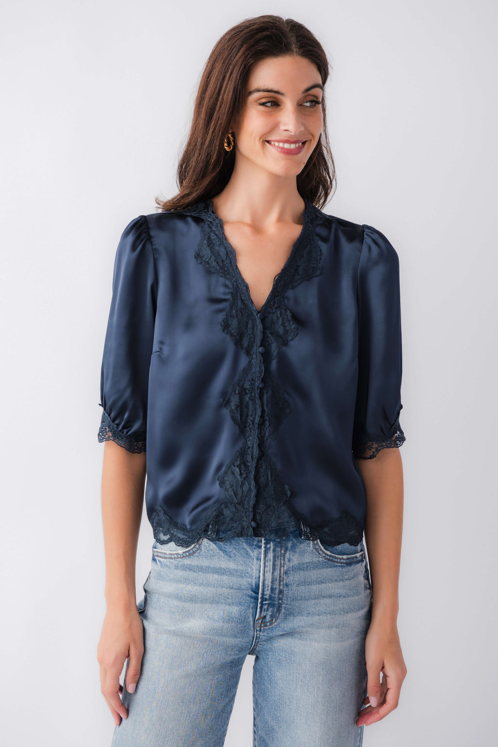 Navy lace trim button-front blouse with short puff sleeves and scalloped lace hem