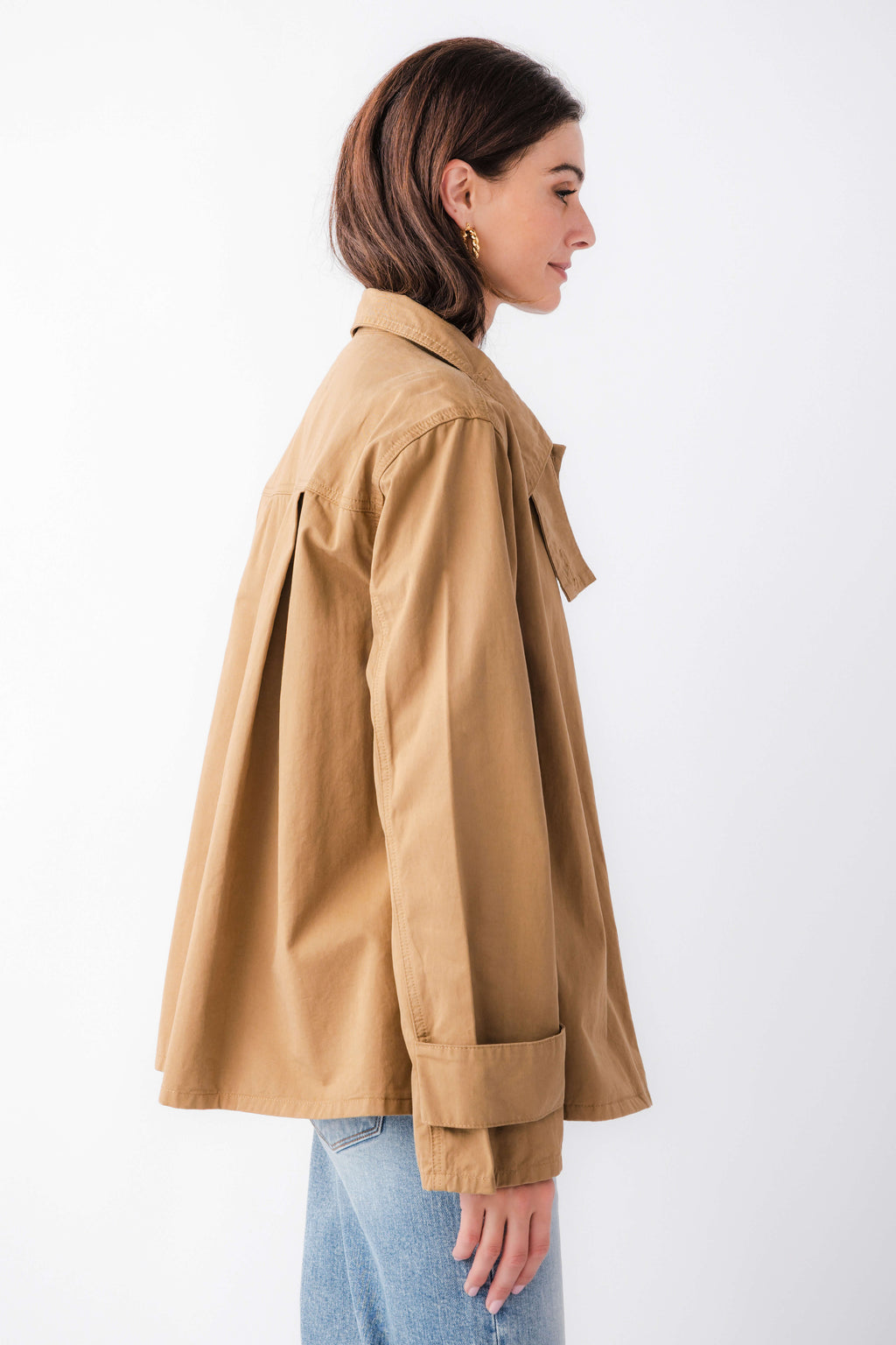 Khaki brown relaxed utility jacket side view with flap pocket and long sleeves
