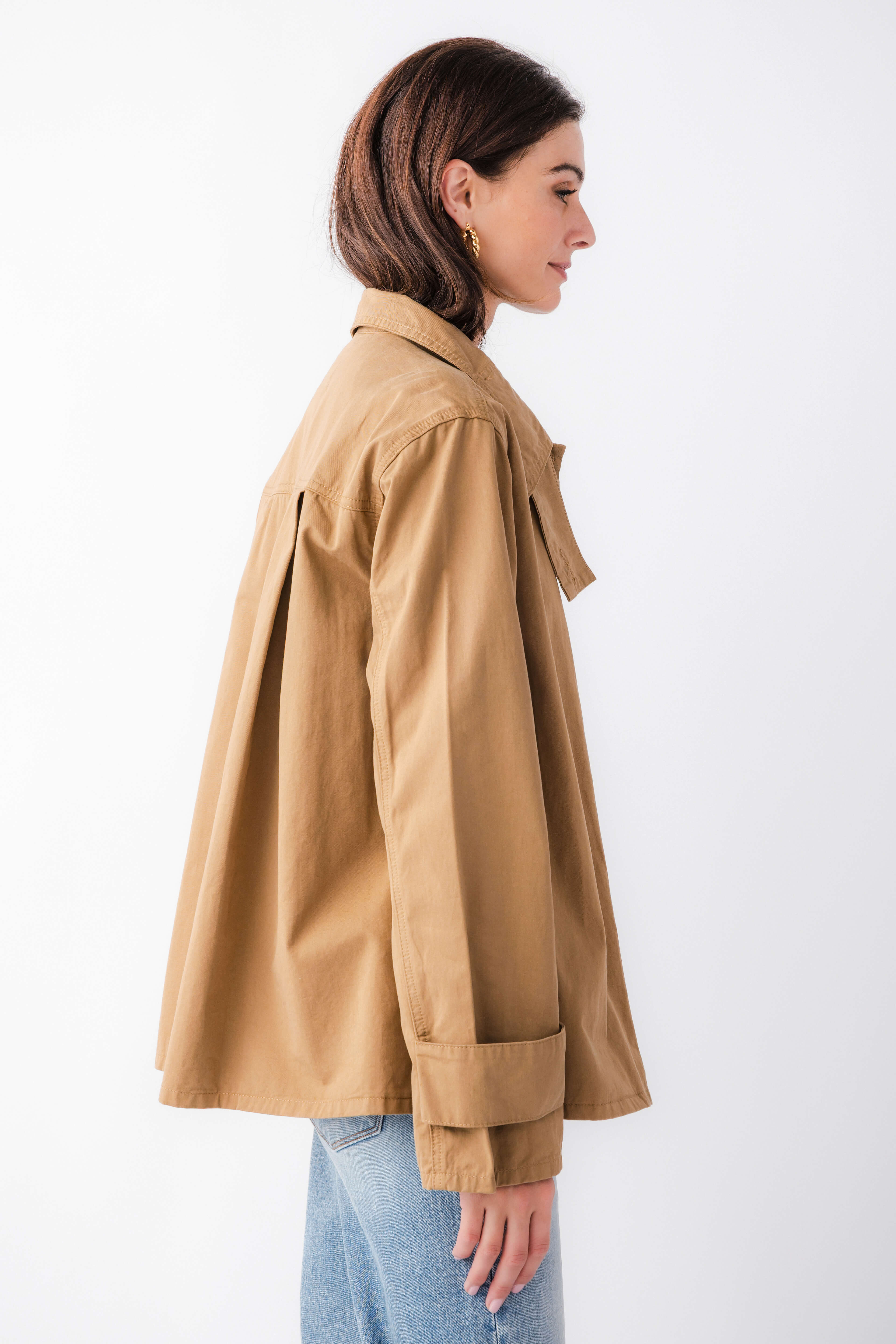 Khaki brown relaxed utility jacket side view with flap pocket and long sleeves