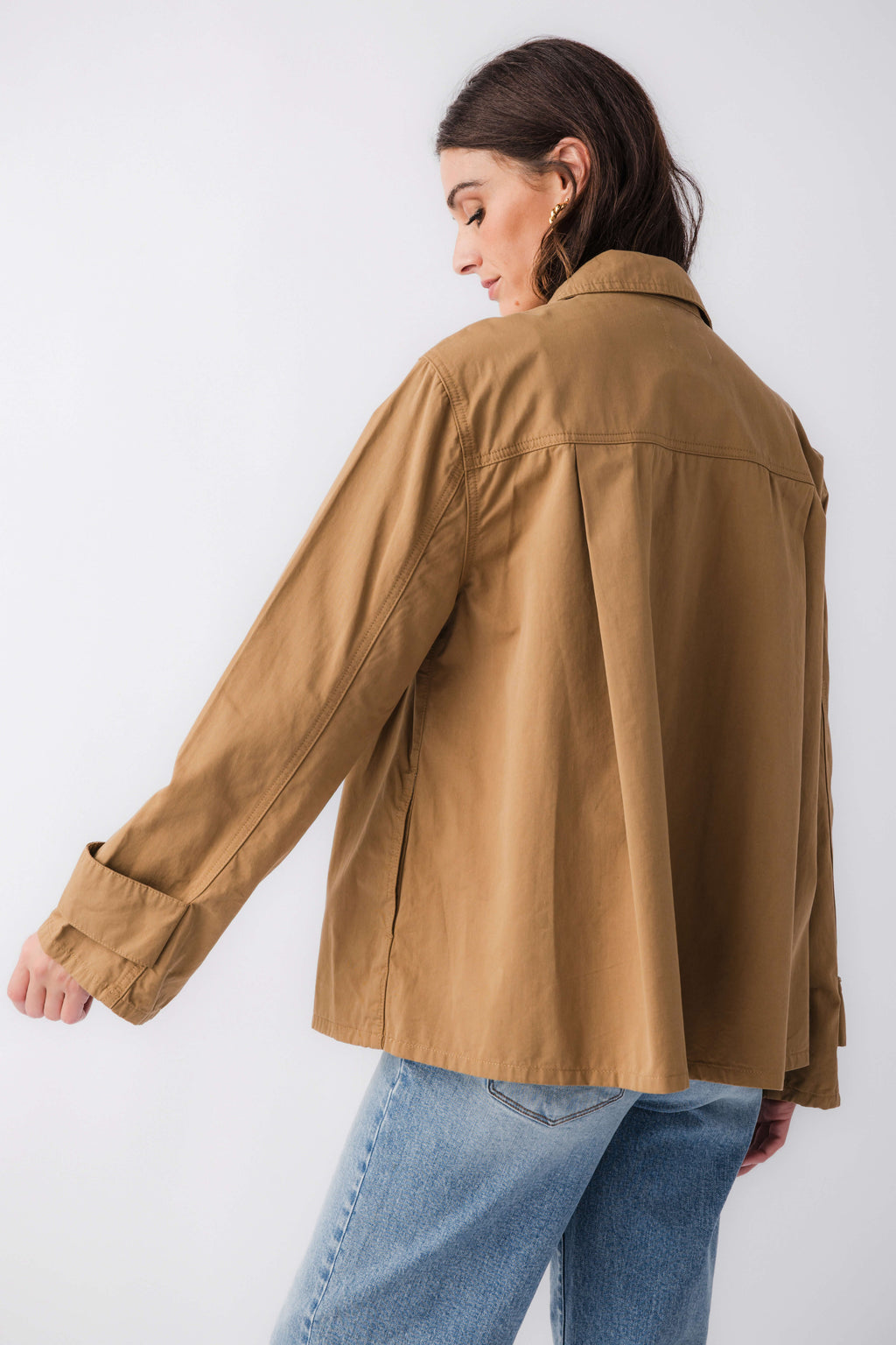 Khaki brown relaxed utility jacket back view with roomy shoulders and button cuffs