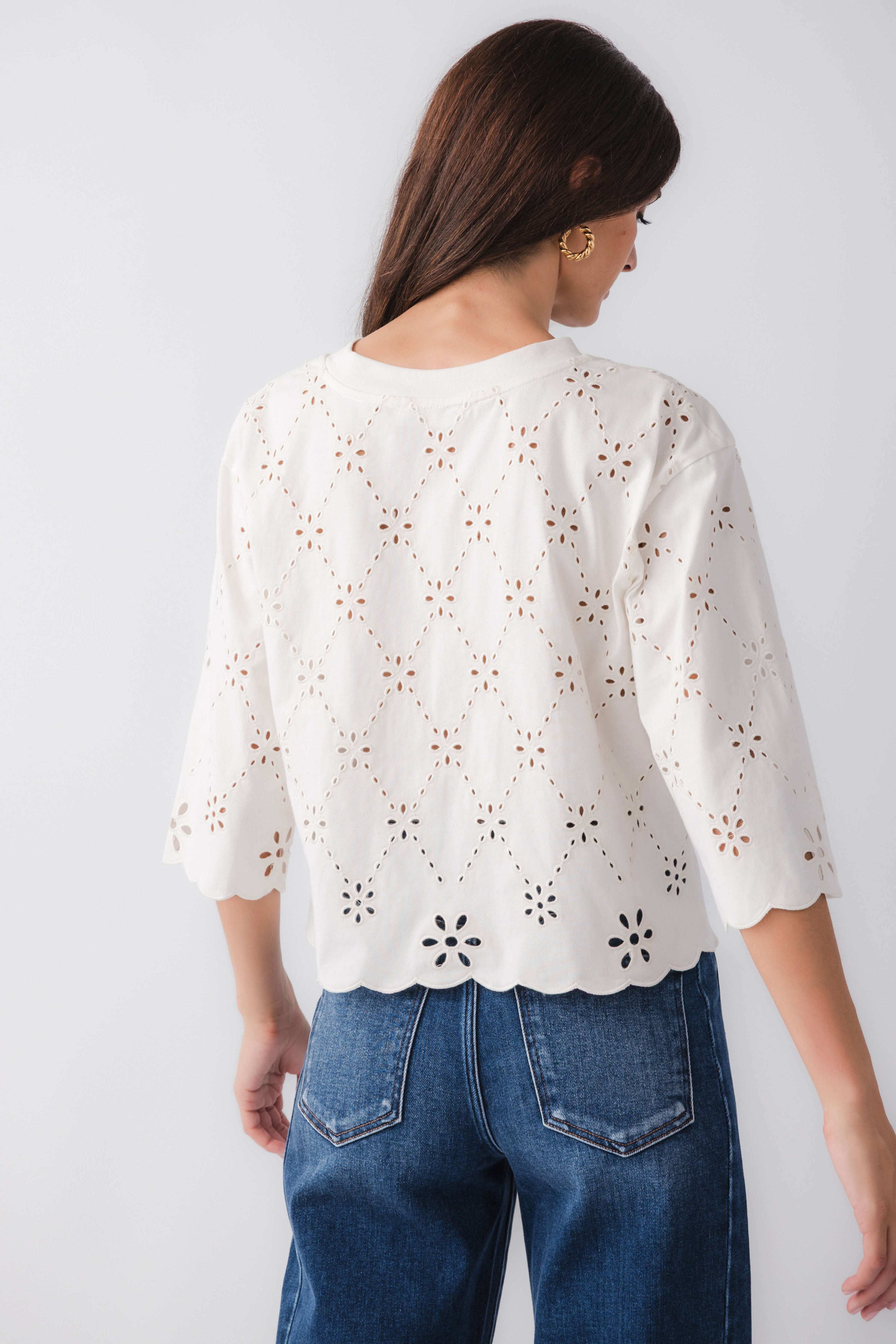 Ivory eyelet scallop top back view with cutout embroidery and scalloped hem, elbow sleeves