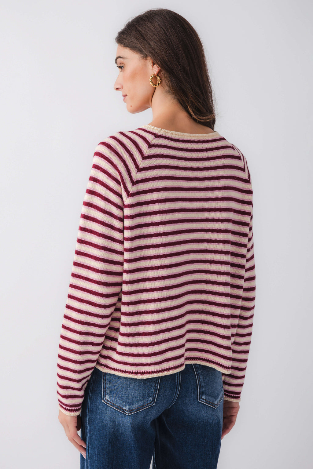 Back view burgundy and pink striped mockneck sweater with long sleeves