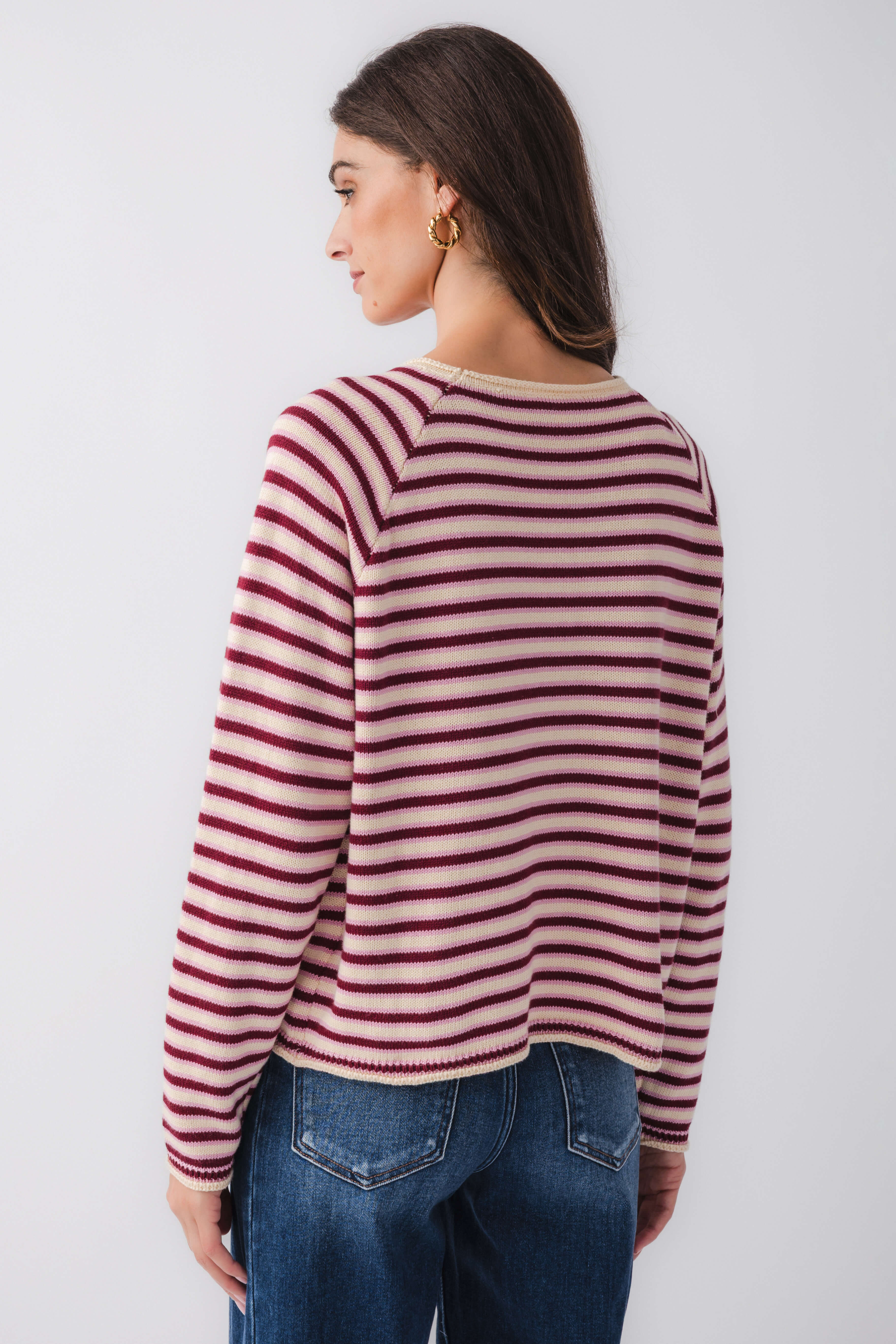 Back view burgundy and pink striped mockneck sweater with long sleeves