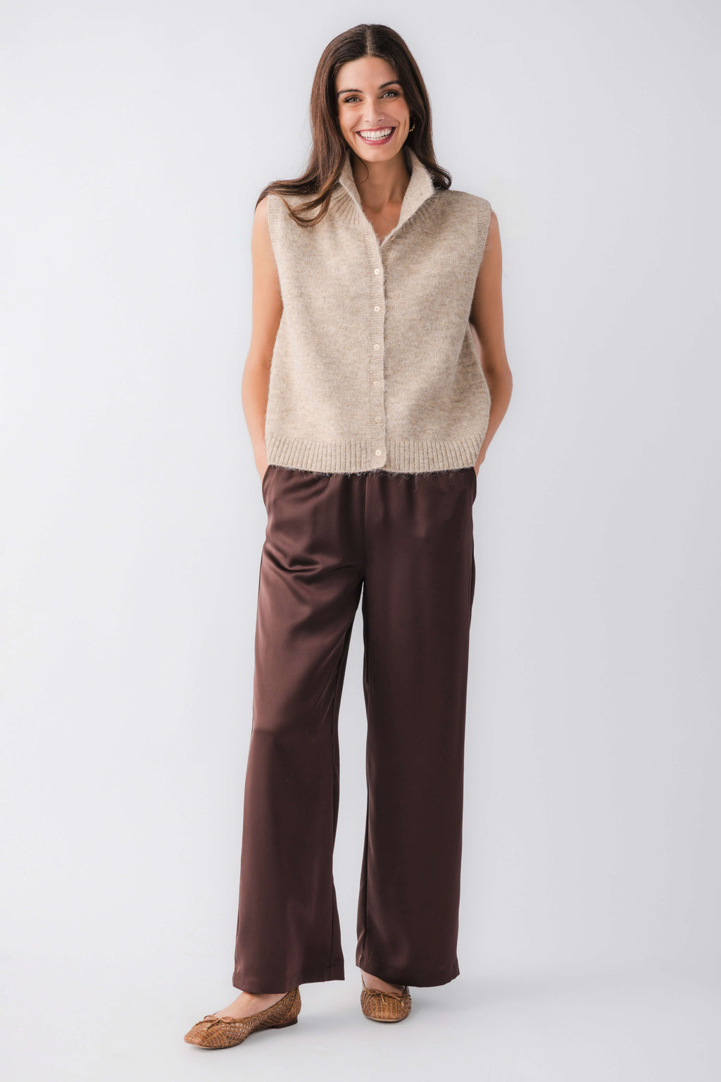 Taupe sleeveless knit sweater vest with button front and ribbed hem