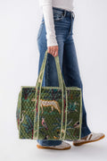 Quilted everyday tote in green with animal print, striped handles, zip top