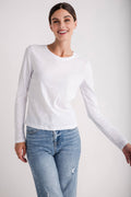 White long-sleeve crewneck slub tee with a straight hem, close-up front view.