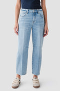 Medium wash barrel jeans in relaxed wide-leg style with belt loops and stitched pockets.