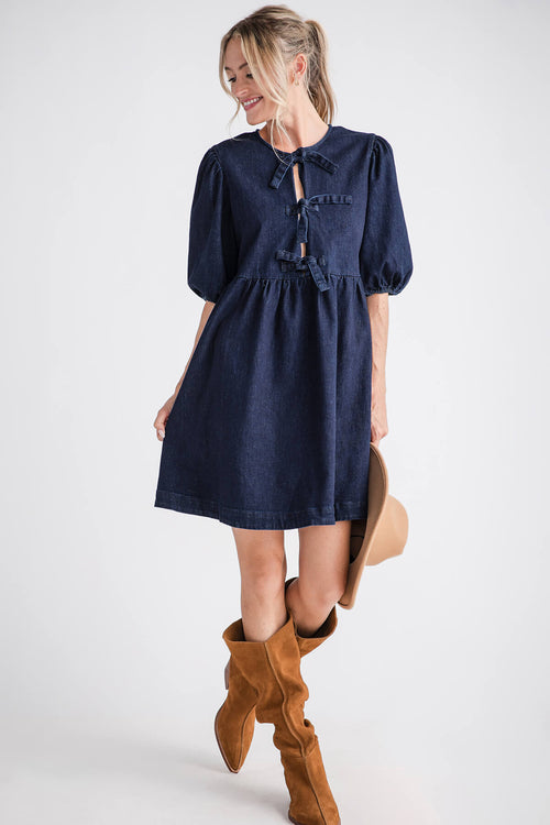 Dark denim babydoll mini dress with ribbon tie neckline and puff sleeves, front view