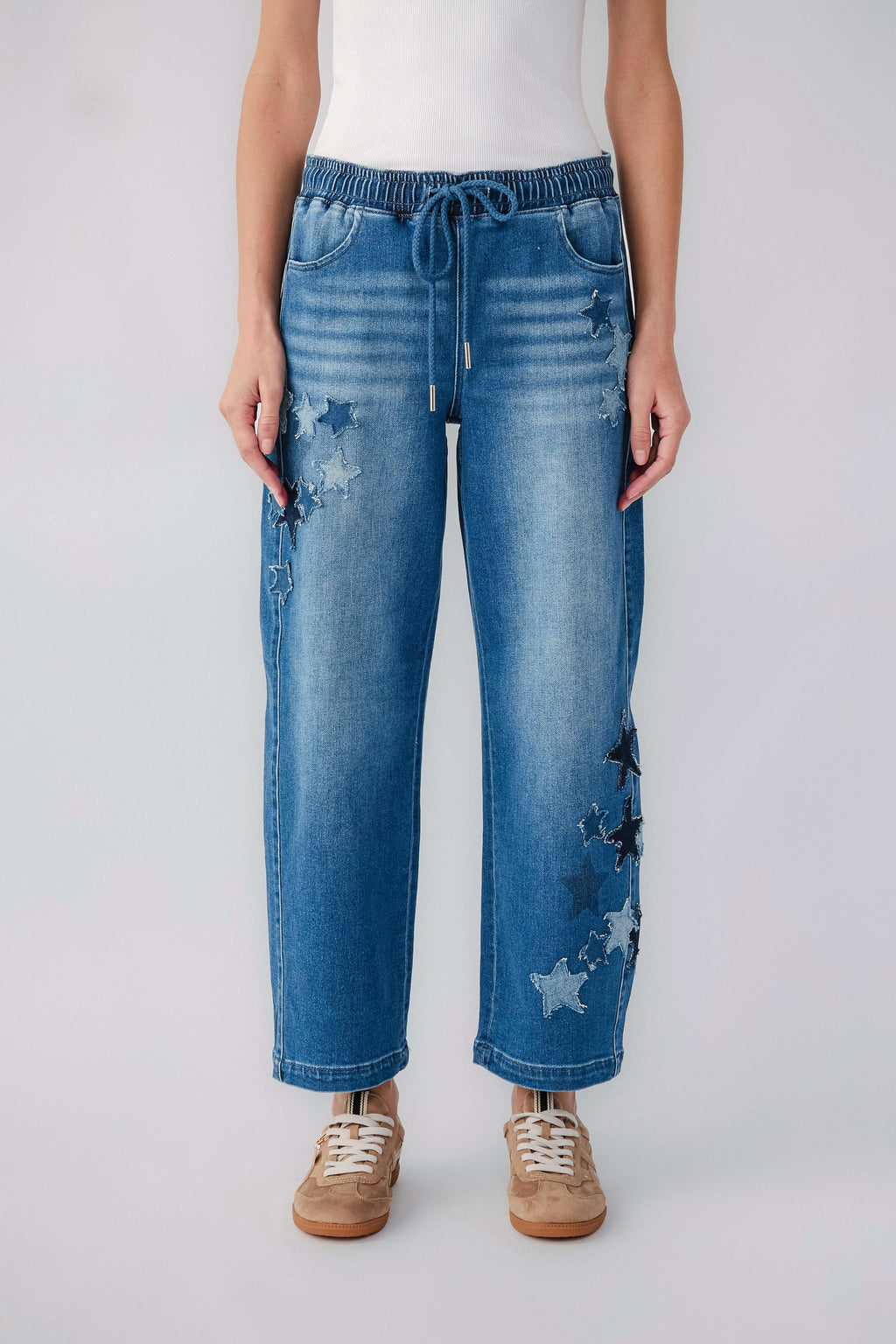 Women's relaxed barrel jeans with pull-on elastic waist and drawstring, star print patches
