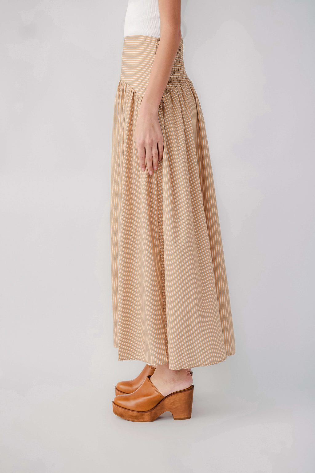 Tan striped maxi skirt with elastic drop-waist and gathered hem