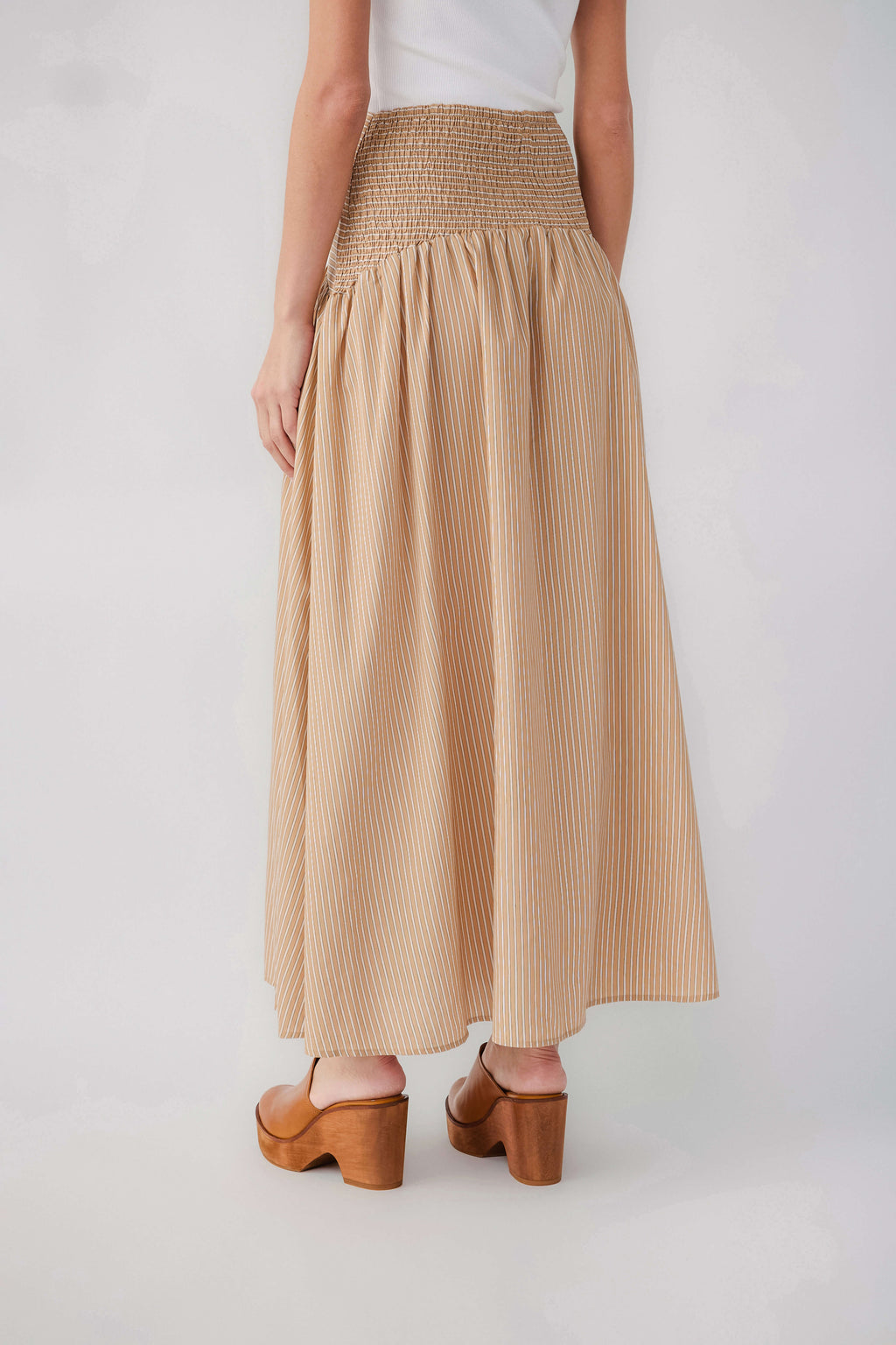 Tan striped drop-waist maxi skirt with elastic waistband and pleated gathers