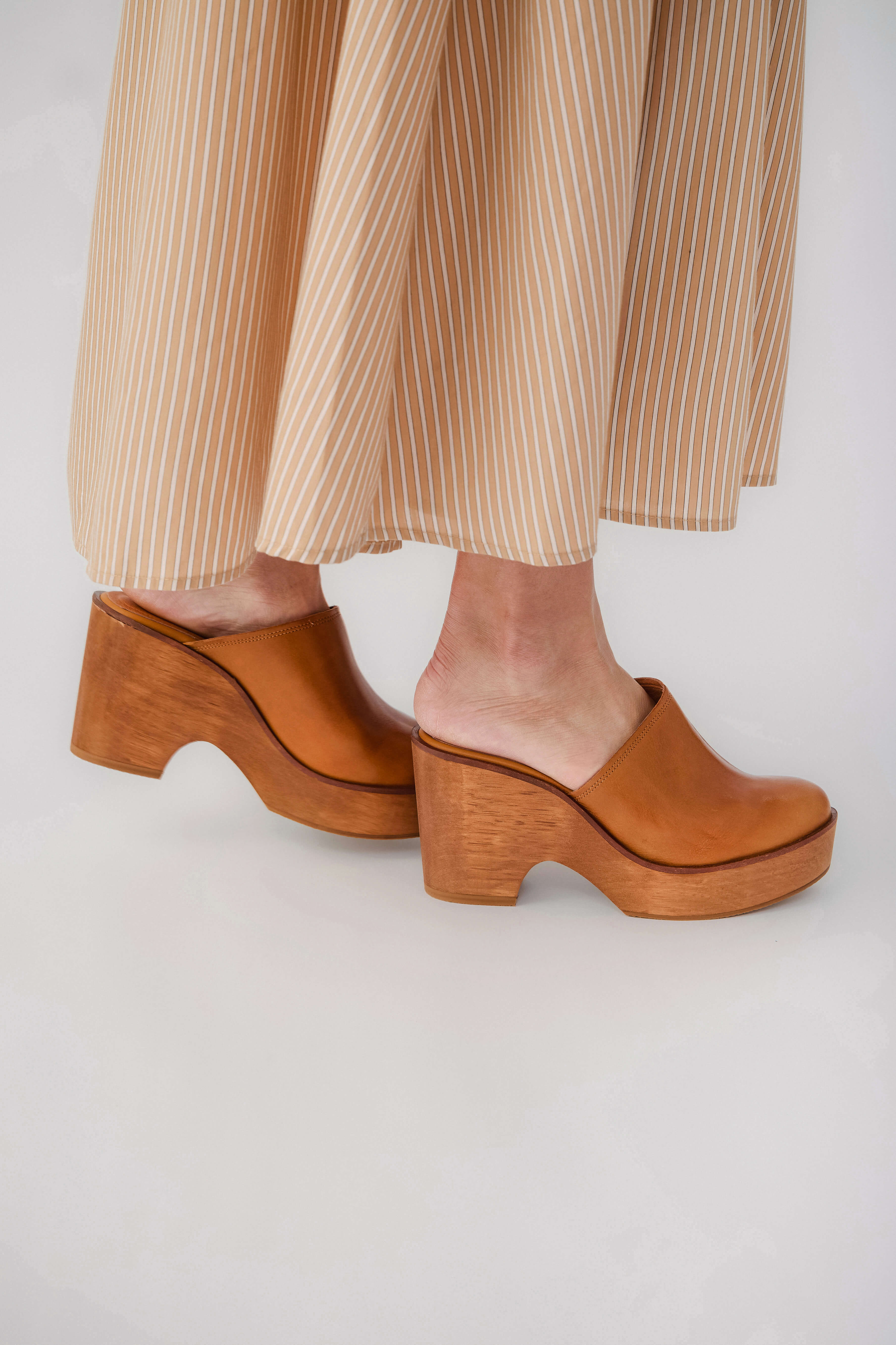 Tan leather wedge clog mules with stacked block heel and smooth rounded toe