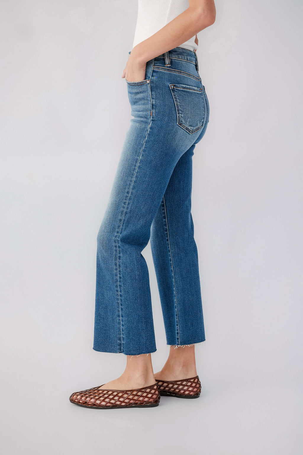 High-rise kick flare jeans in medium blue wash, back yoke, belt loops, pockets