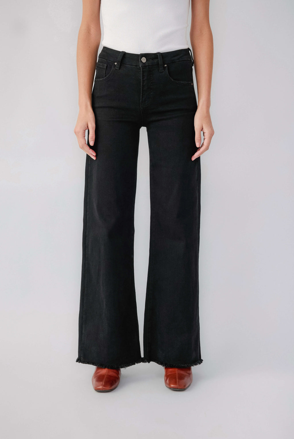 Black high-rise wide-leg jeans with raw hem and button fly