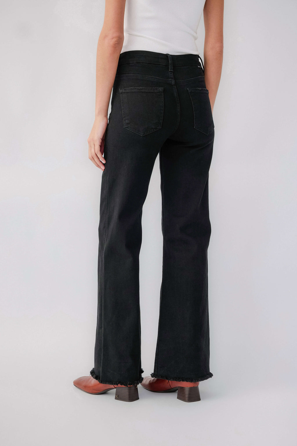 Black high-rise wide-leg jeans with raw hem and back yoke detail