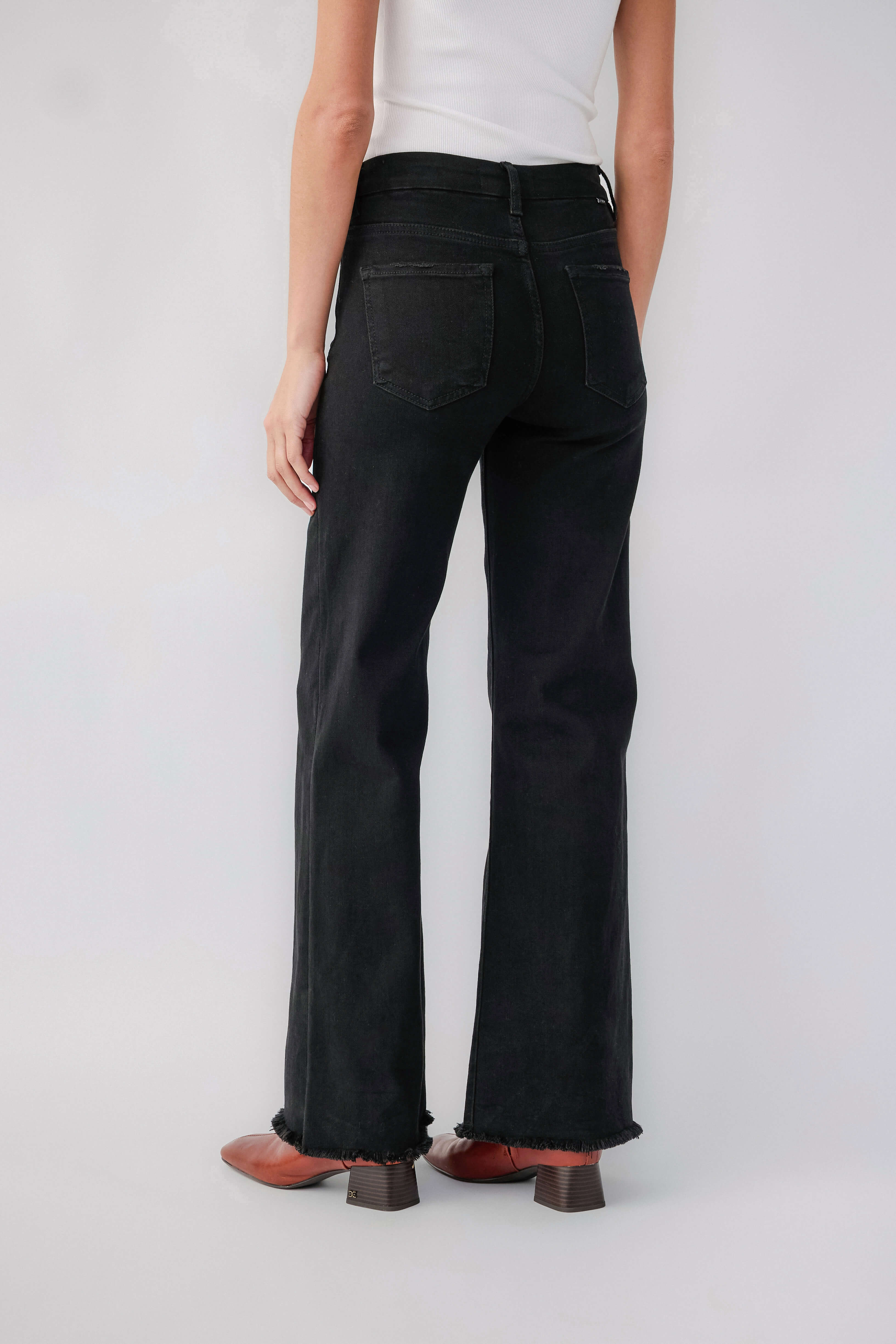 Black high-rise wide-leg jeans with raw hem and back yoke detail