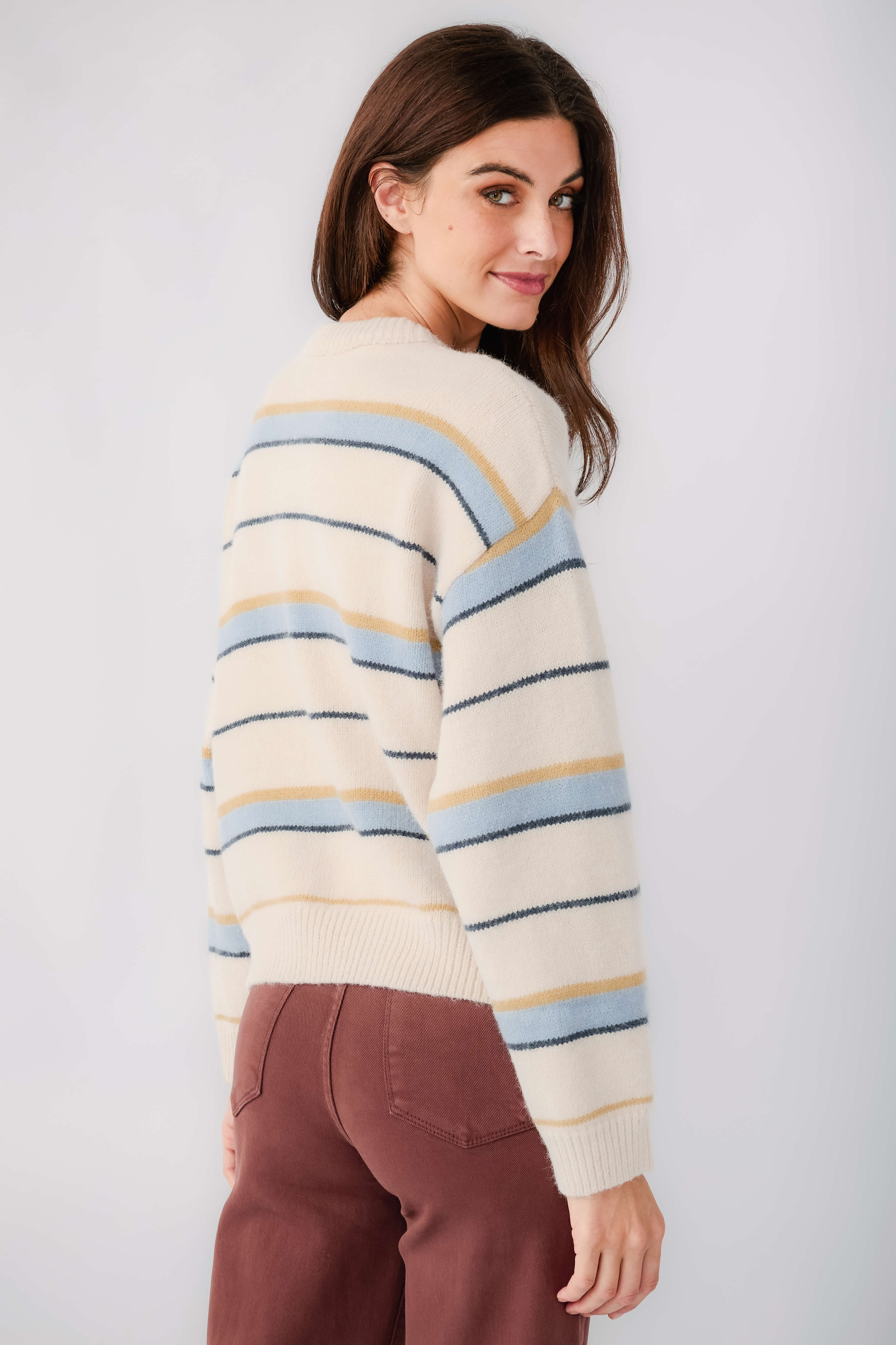 Striped crewneck sweater with blue and yellow horizontal stripes, ribbed cuffs