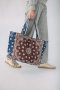 Brown and navy bandana print tote bag with long blue-trimmed handles