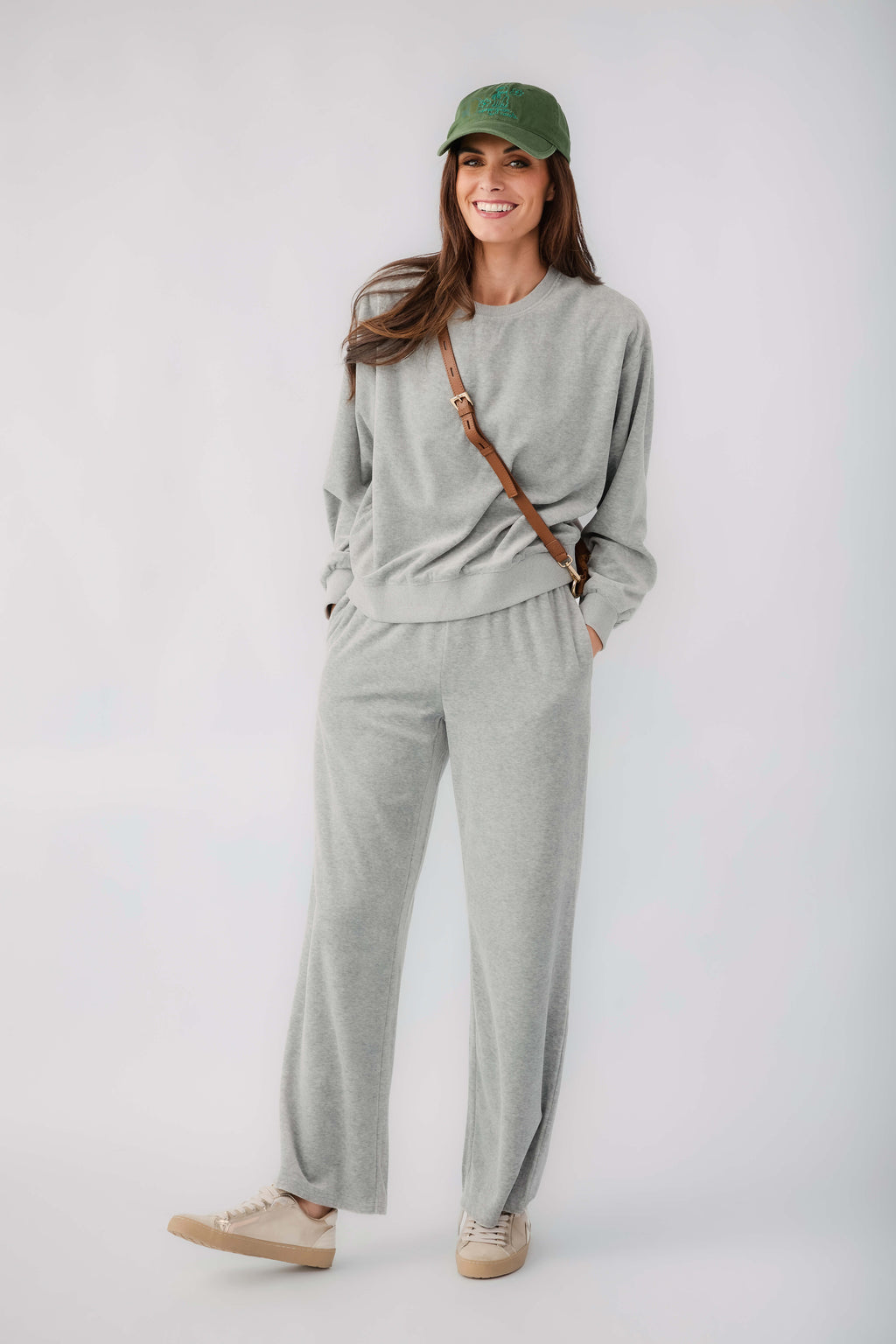 Grey velour pullover sweatshirt and matching drawstring sweatpants, front view